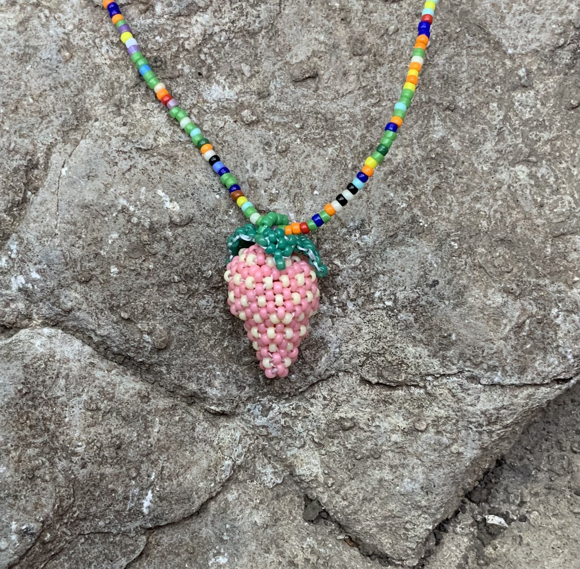 Pink beaded strawberry pendant
