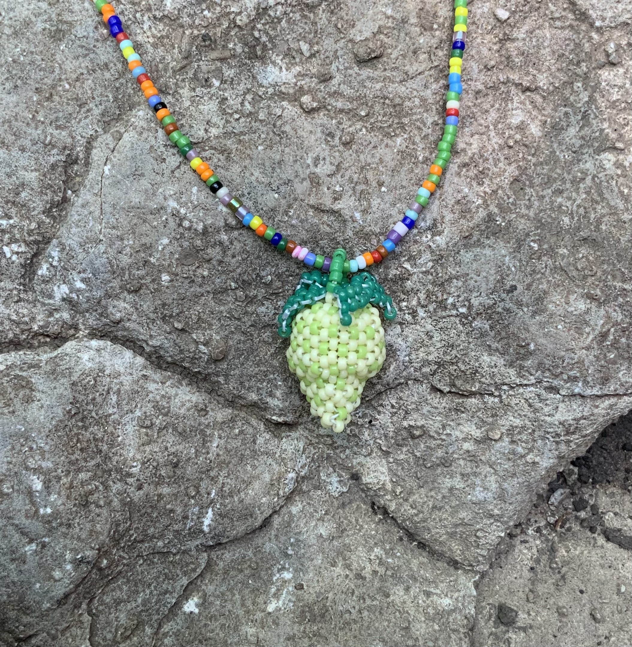 Unripe beaded strawberry pendant