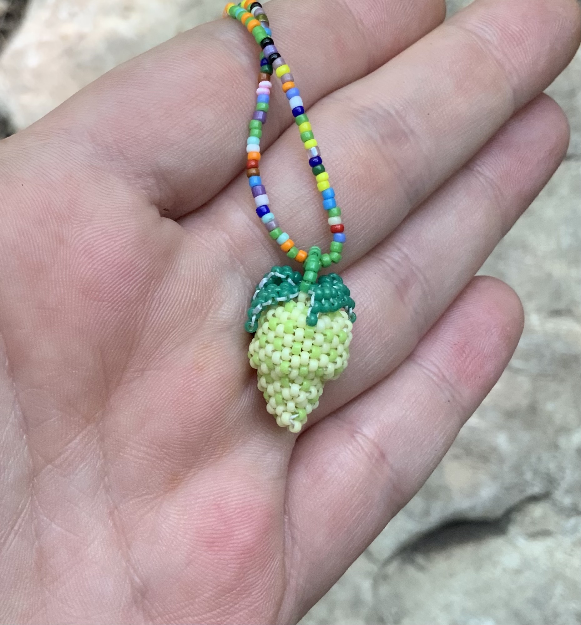 Unripe beaded strawberry pendant
