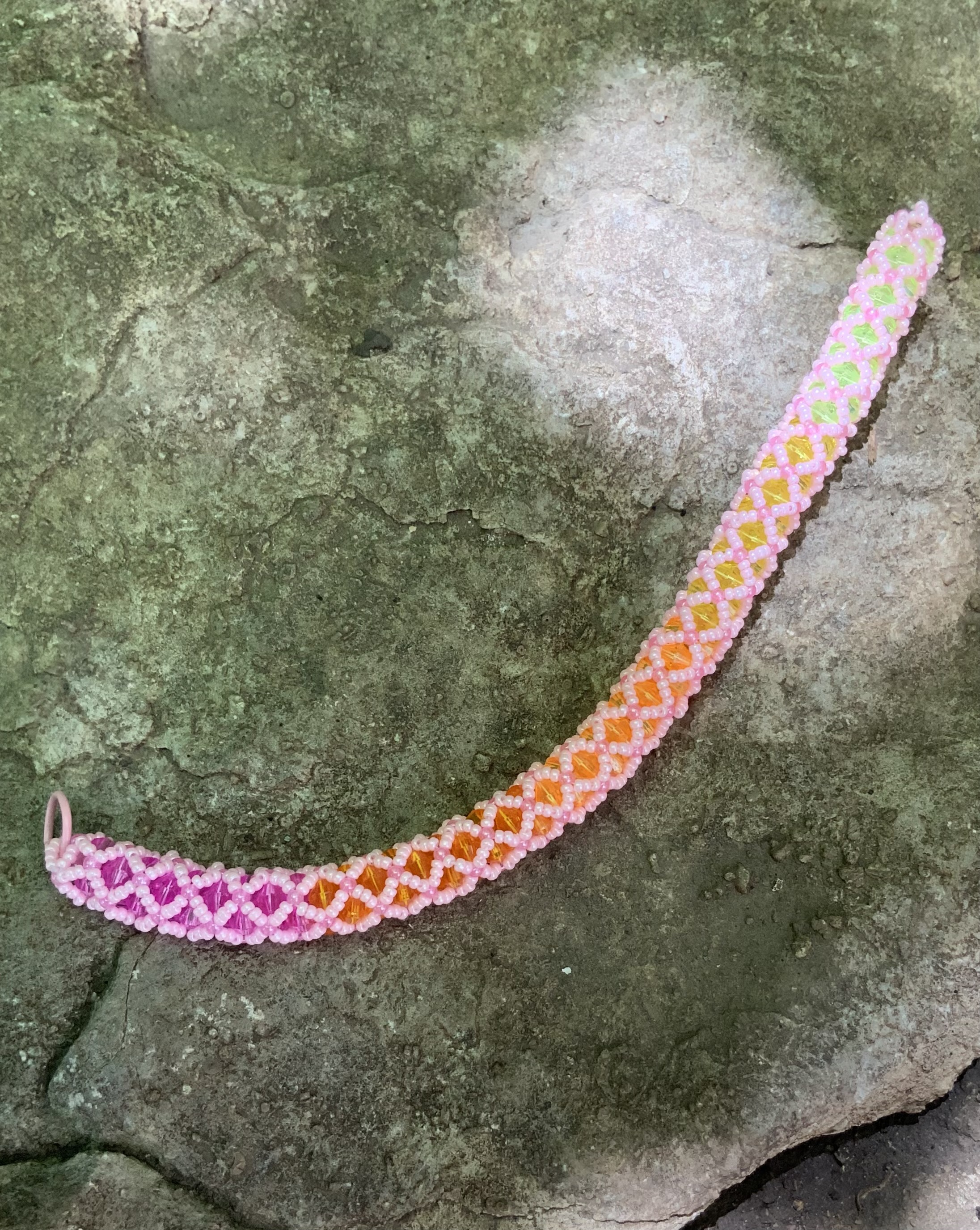 Pink rainbow haze tubular netting beaded bracelet
