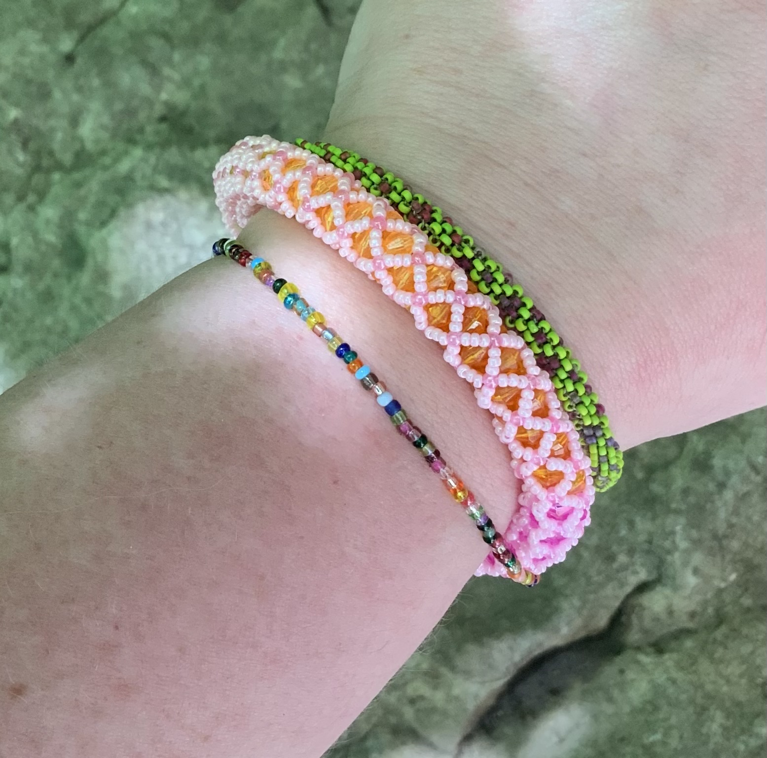 Pink rainbow haze tubular netting beaded bracelet