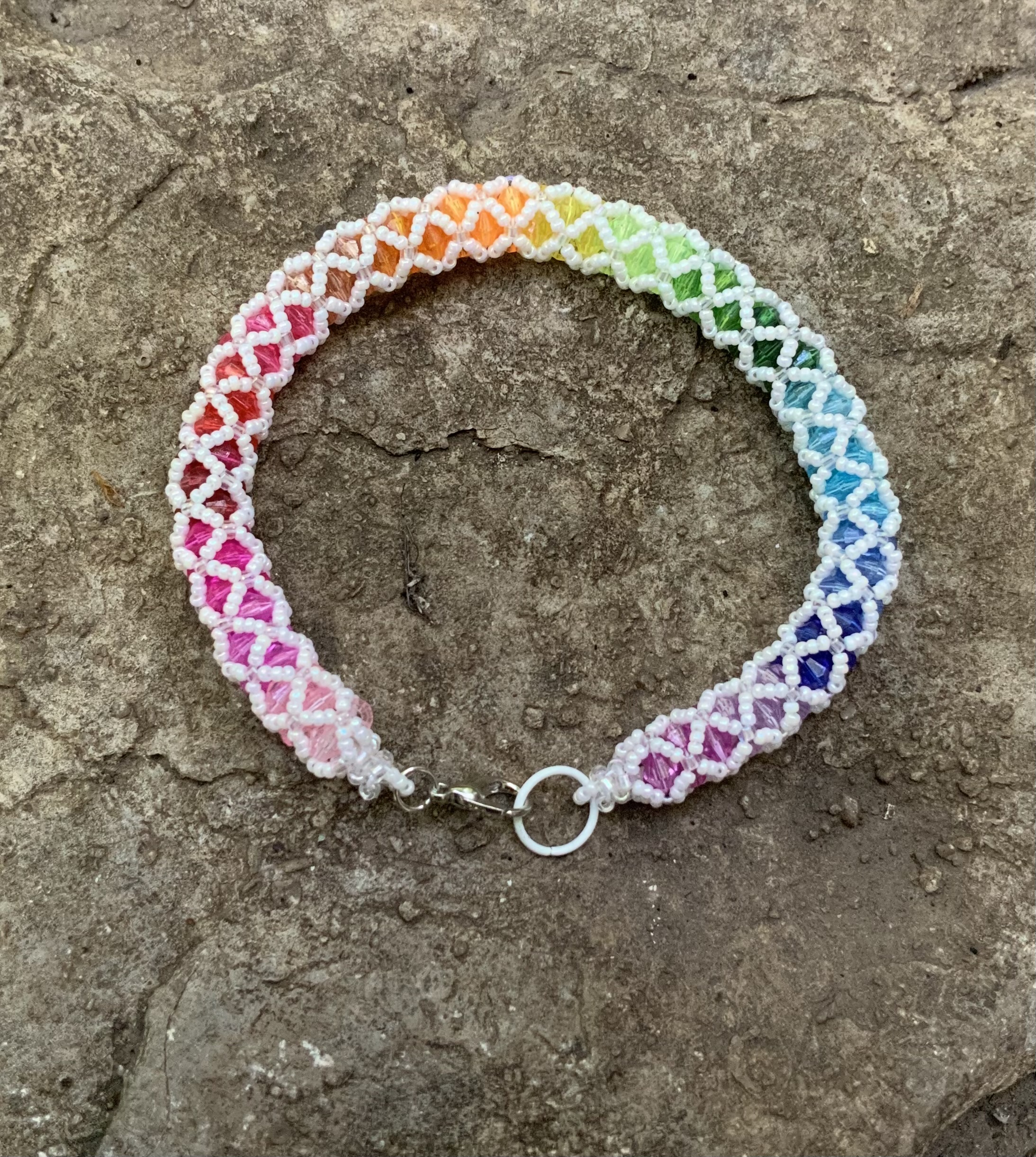 Pearly white and rainbow tubular netting bracelet 