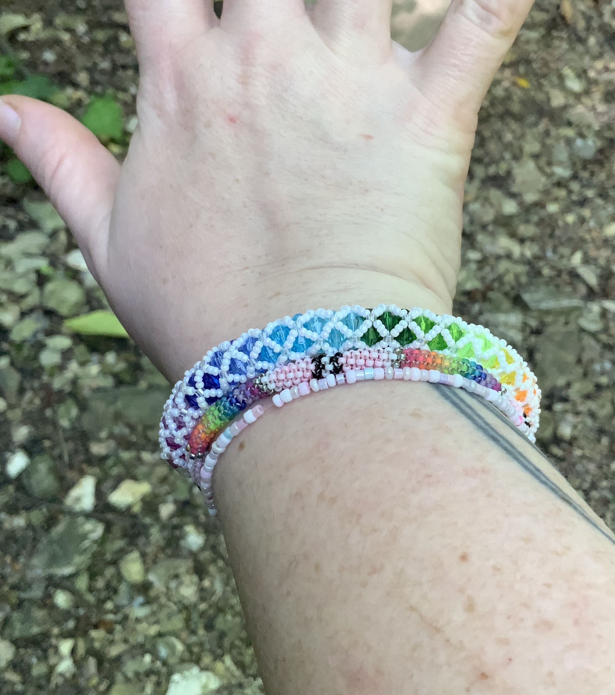 Pearly white and rainbow tubular netting bracelet 