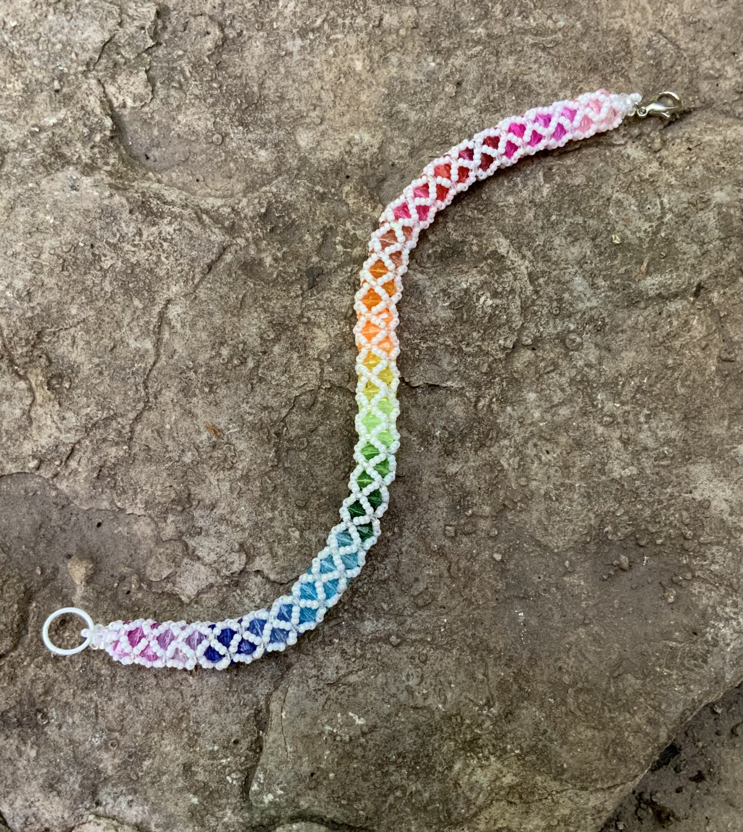 Pearly white and rainbow tubular netting bracelet 