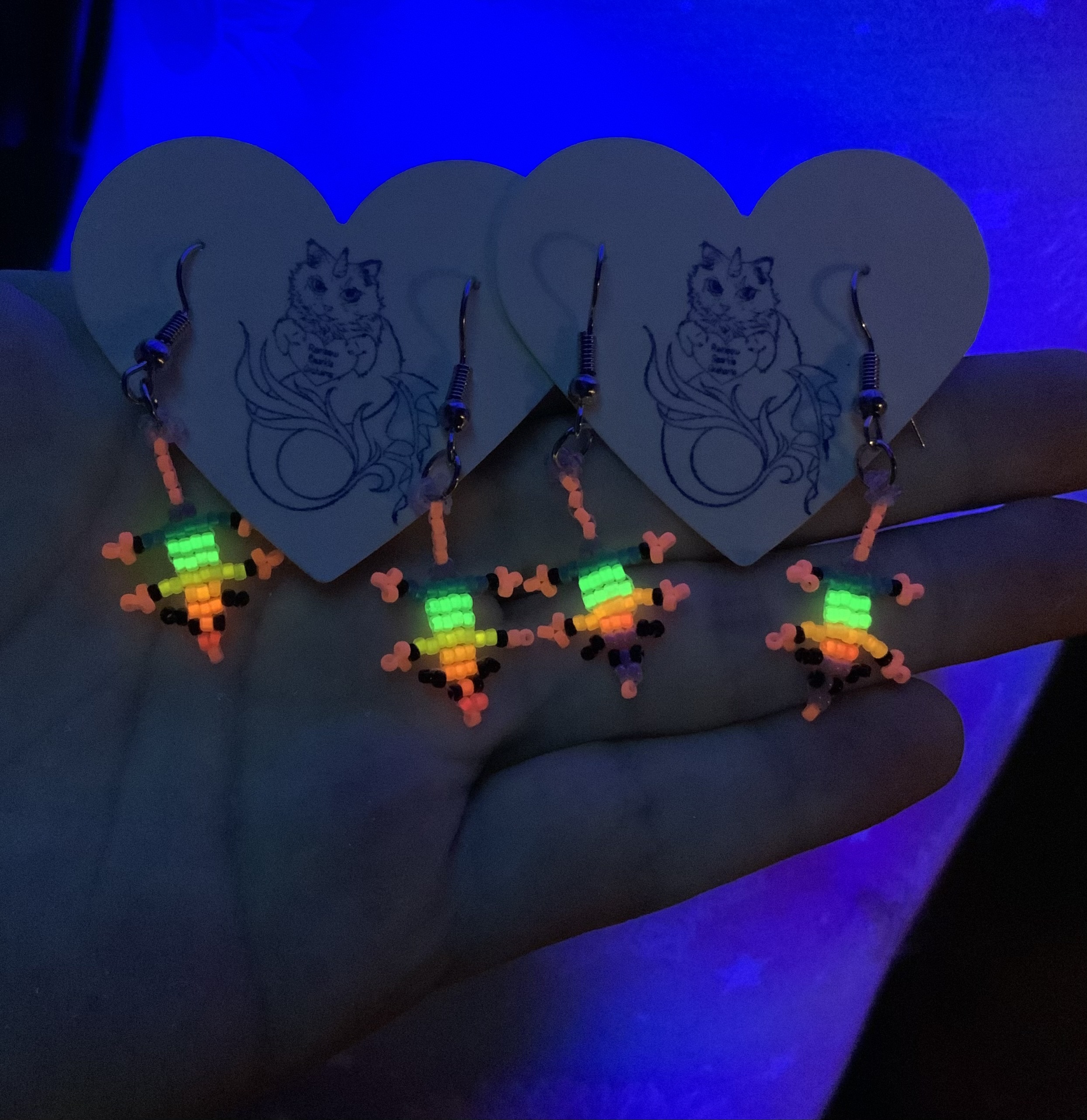 Rainbow beaded opossum earrings