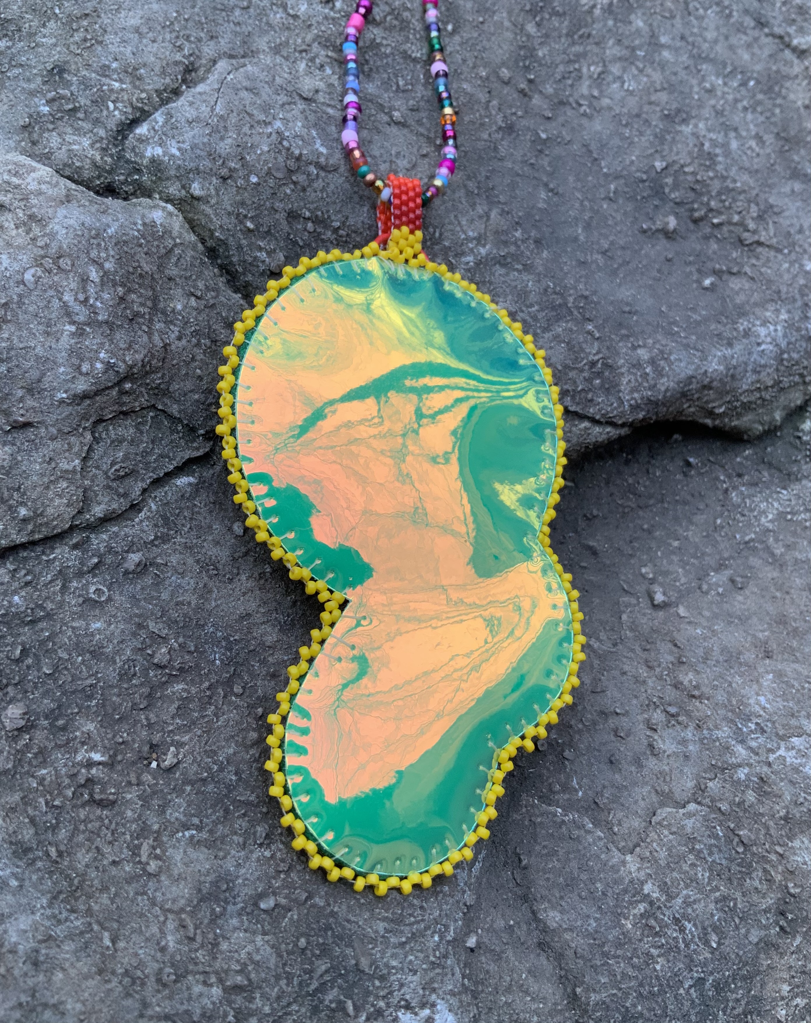 Santa’s eye bead embroidered pendant