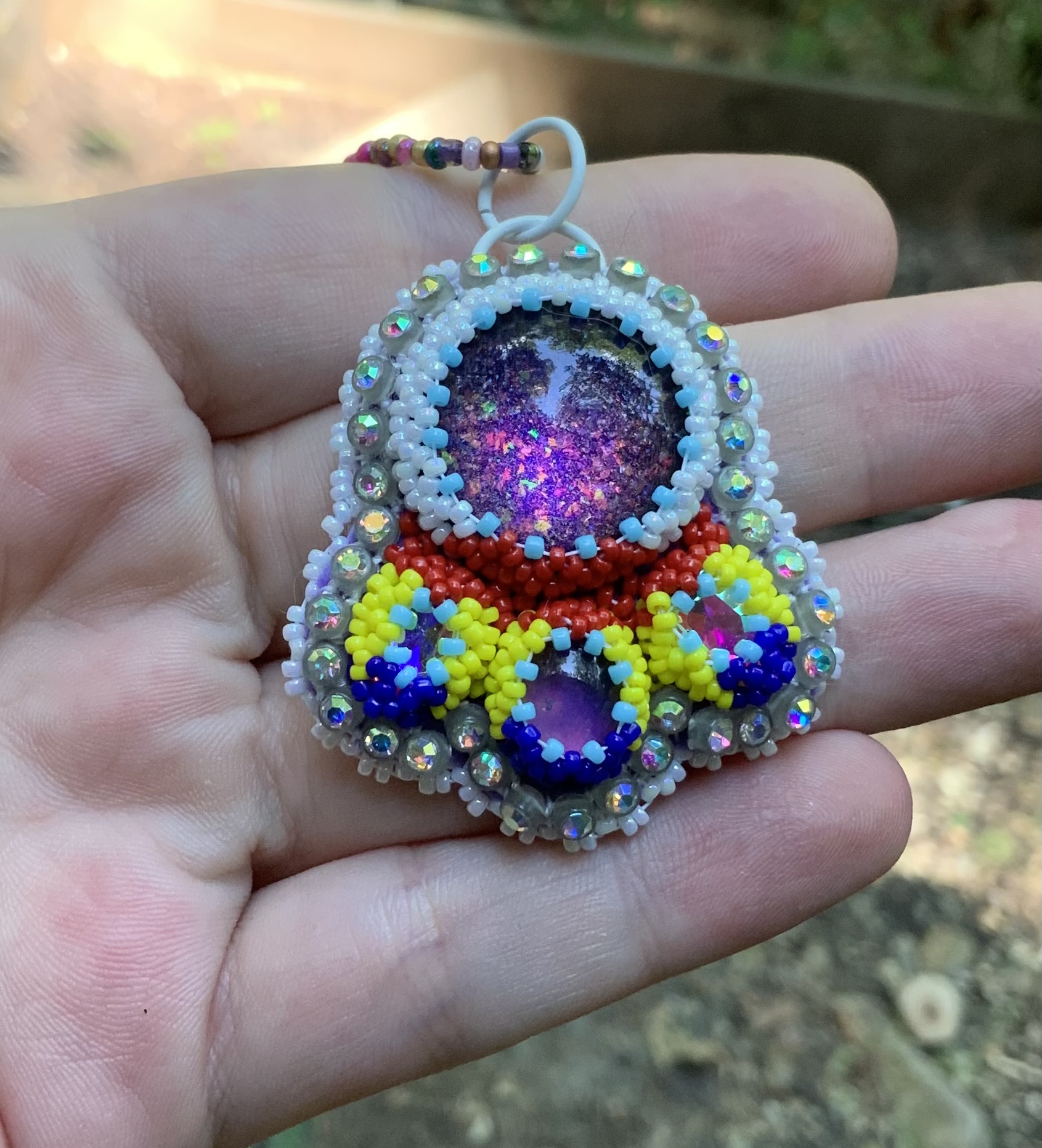 Intergalactic beam beaded pendant