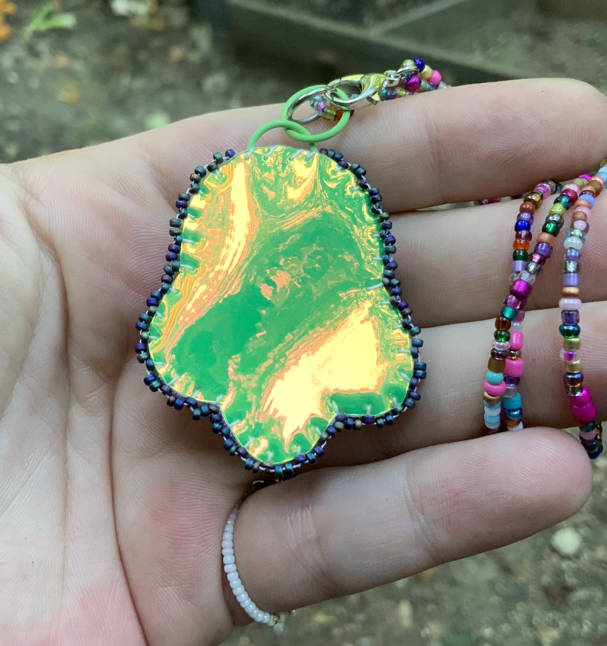 Green heat beaded pendant