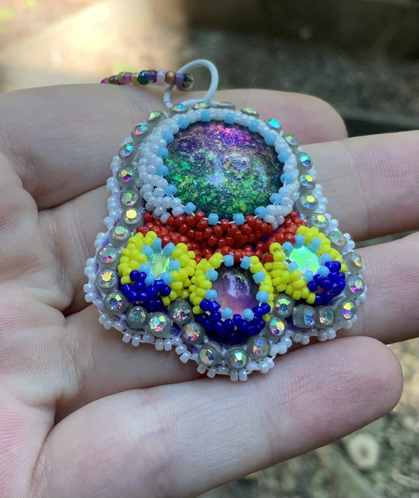 Intergalactic beam beaded pendant