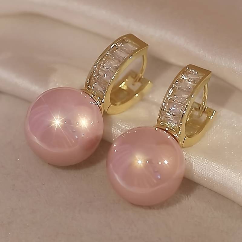  Pretty Hoop Earrings Designed With A Beautiful Pink Imitation Pearl.