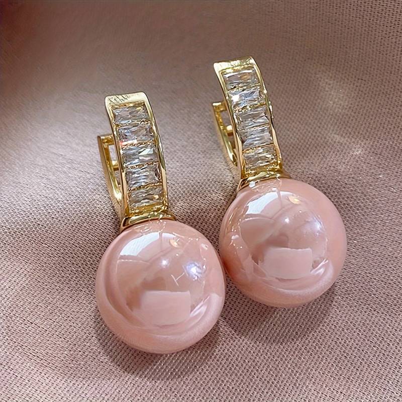  Pretty Hoop Earrings Designed With A Beautiful Pink Imitation Pearl.