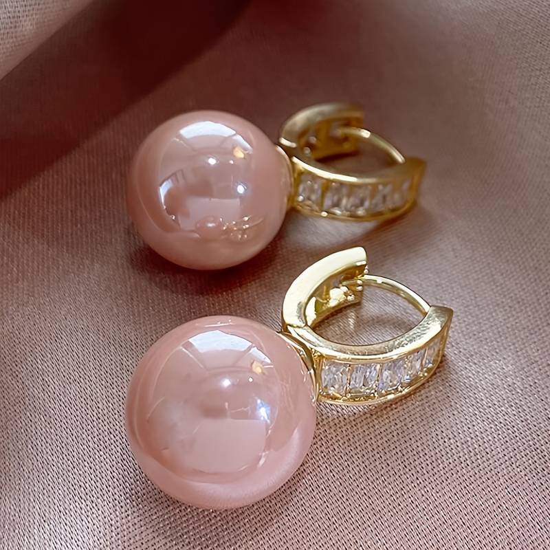  Pretty Hoop Earrings Designed With A Beautiful Pink Imitation Pearl.