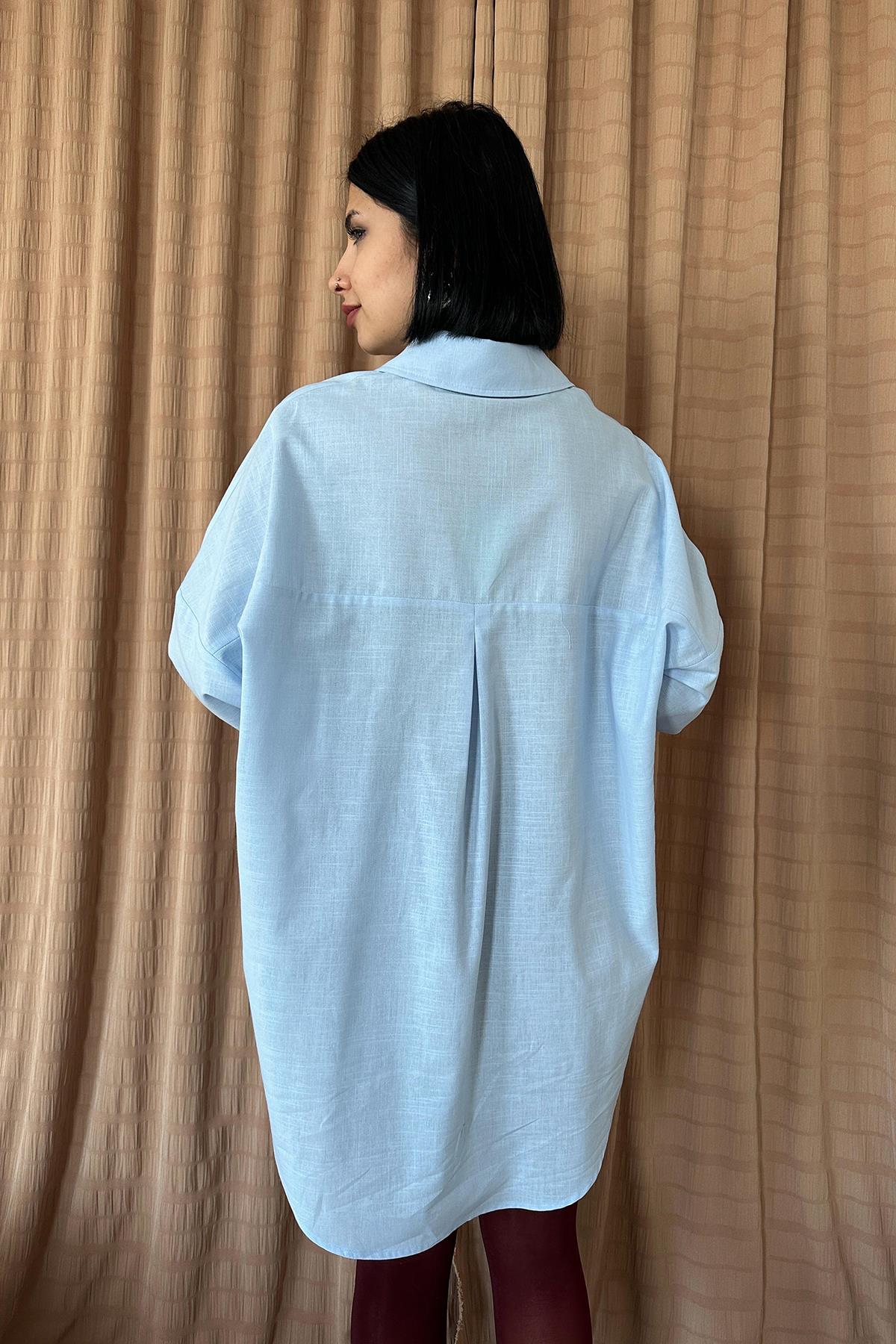 Šviesiai mėlyni oversize marškiniai