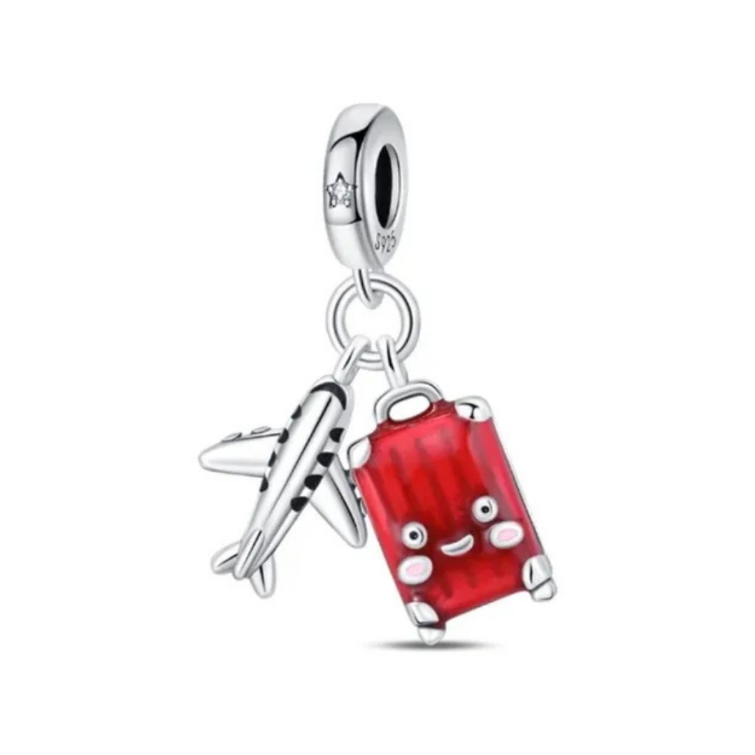 Charm de viaje avión y maleta roja 
