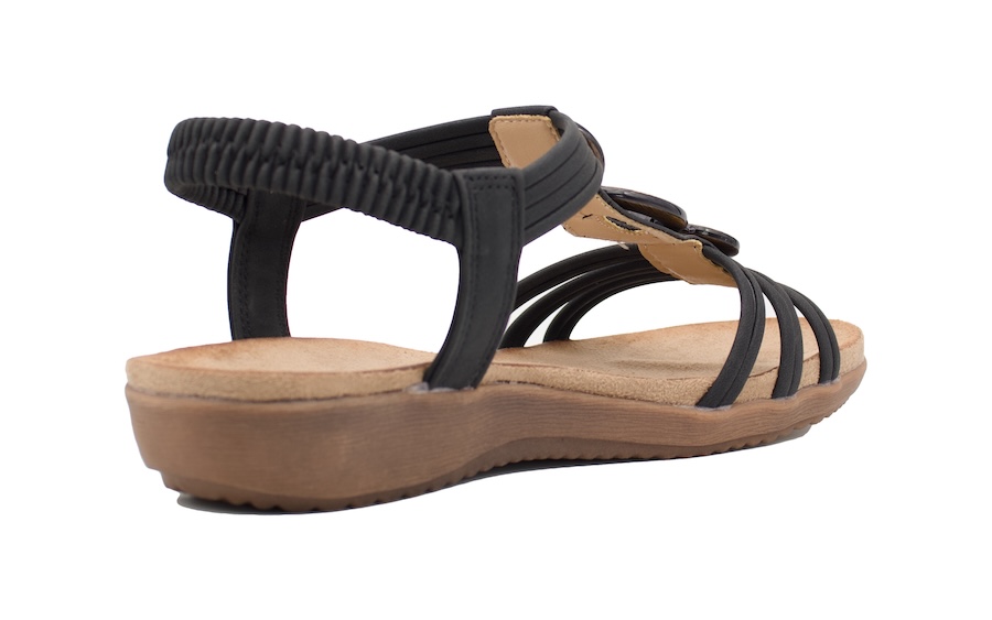 Sandalias planas negras con adorno de madera en el empeine