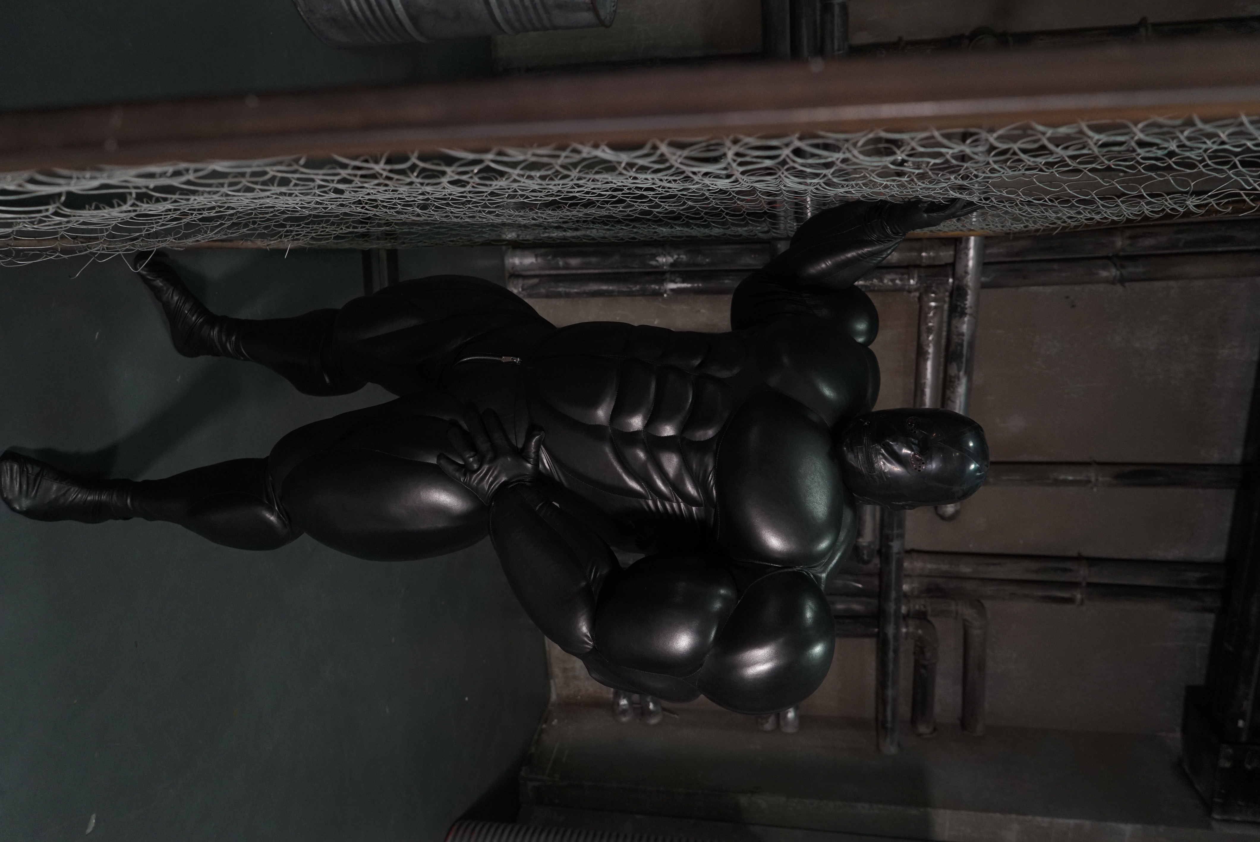 Giant muscle suit / black faux leather 