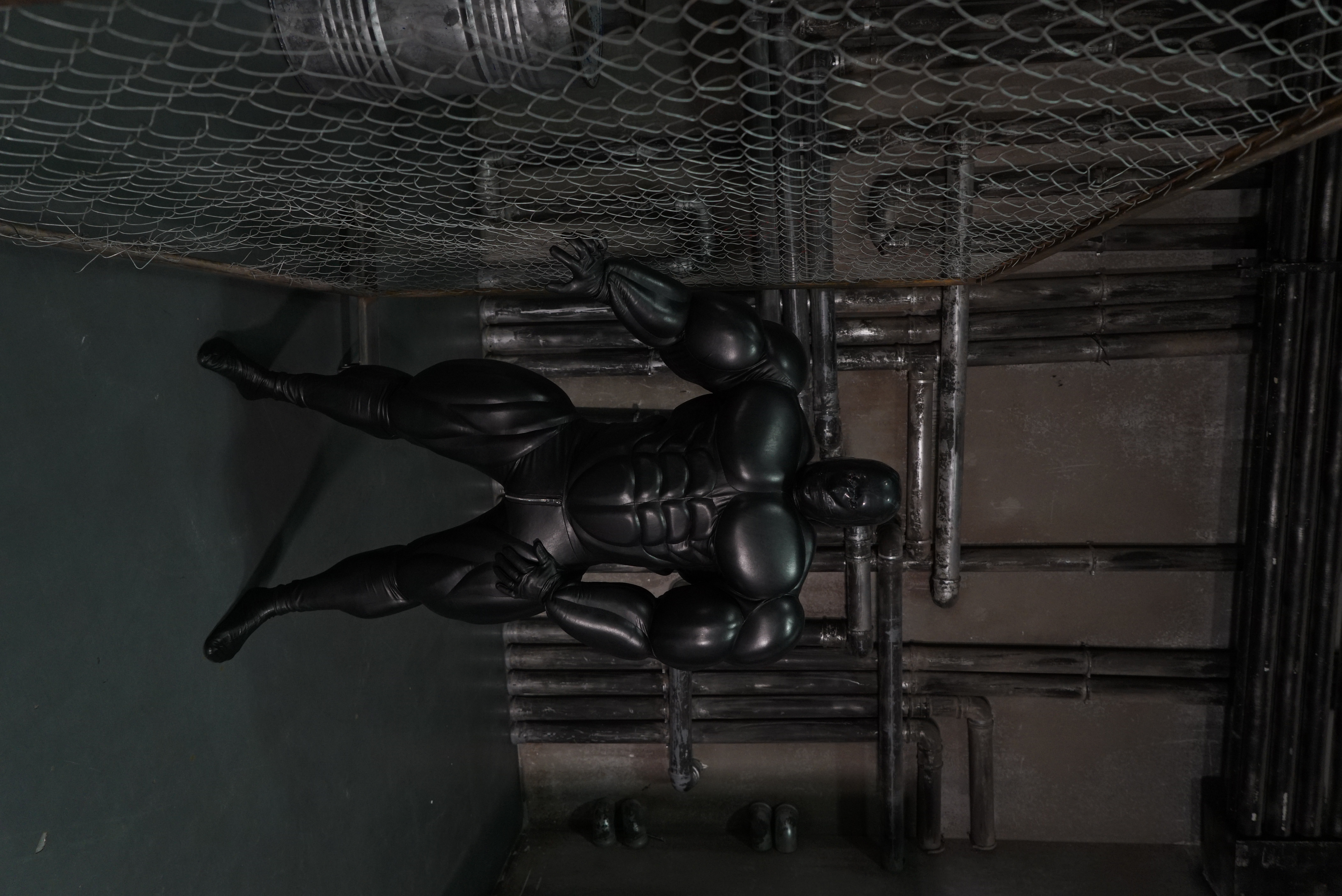 Giant muscle suit / black faux leather 