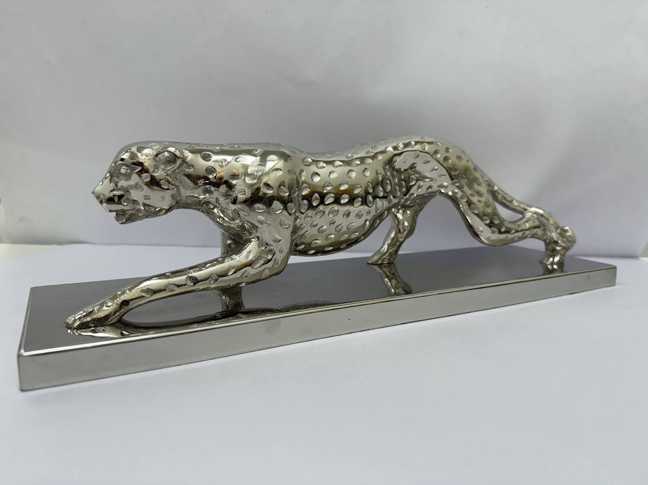 Stealth in Motion – Metallic Panther Sculptures