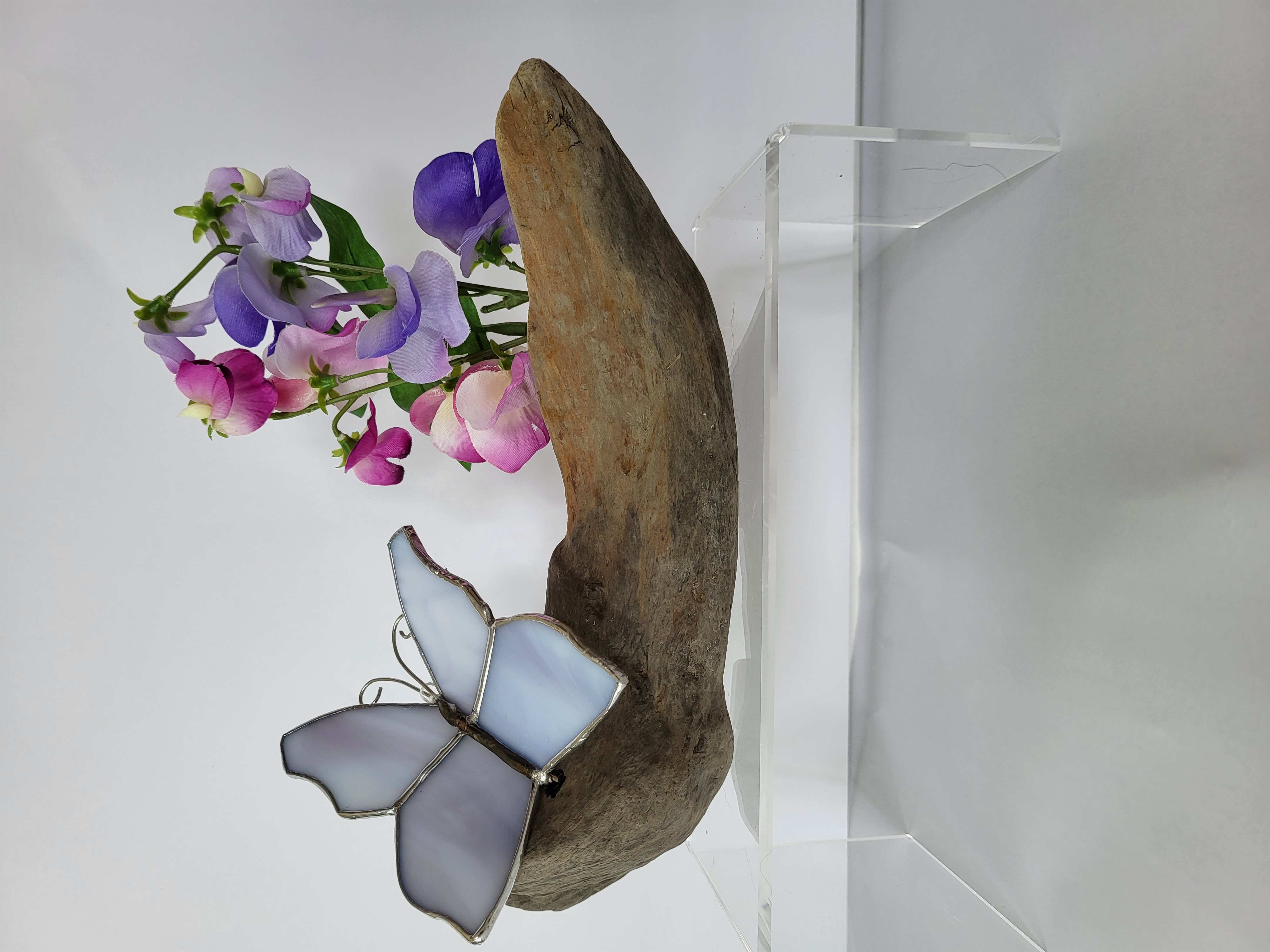 Butterflies and sweet peas on driftwood