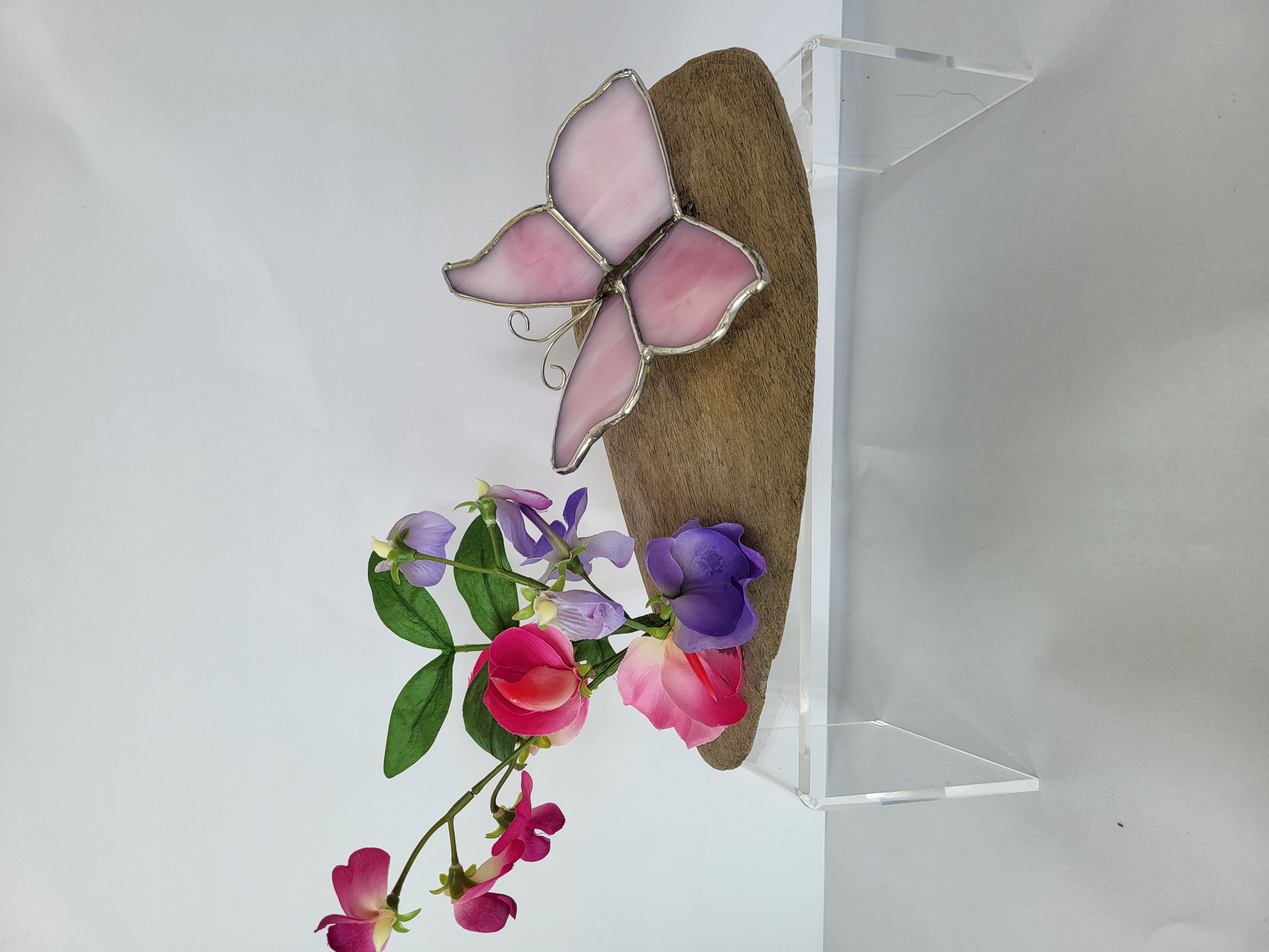 Butterflies and sweet peas on driftwood
