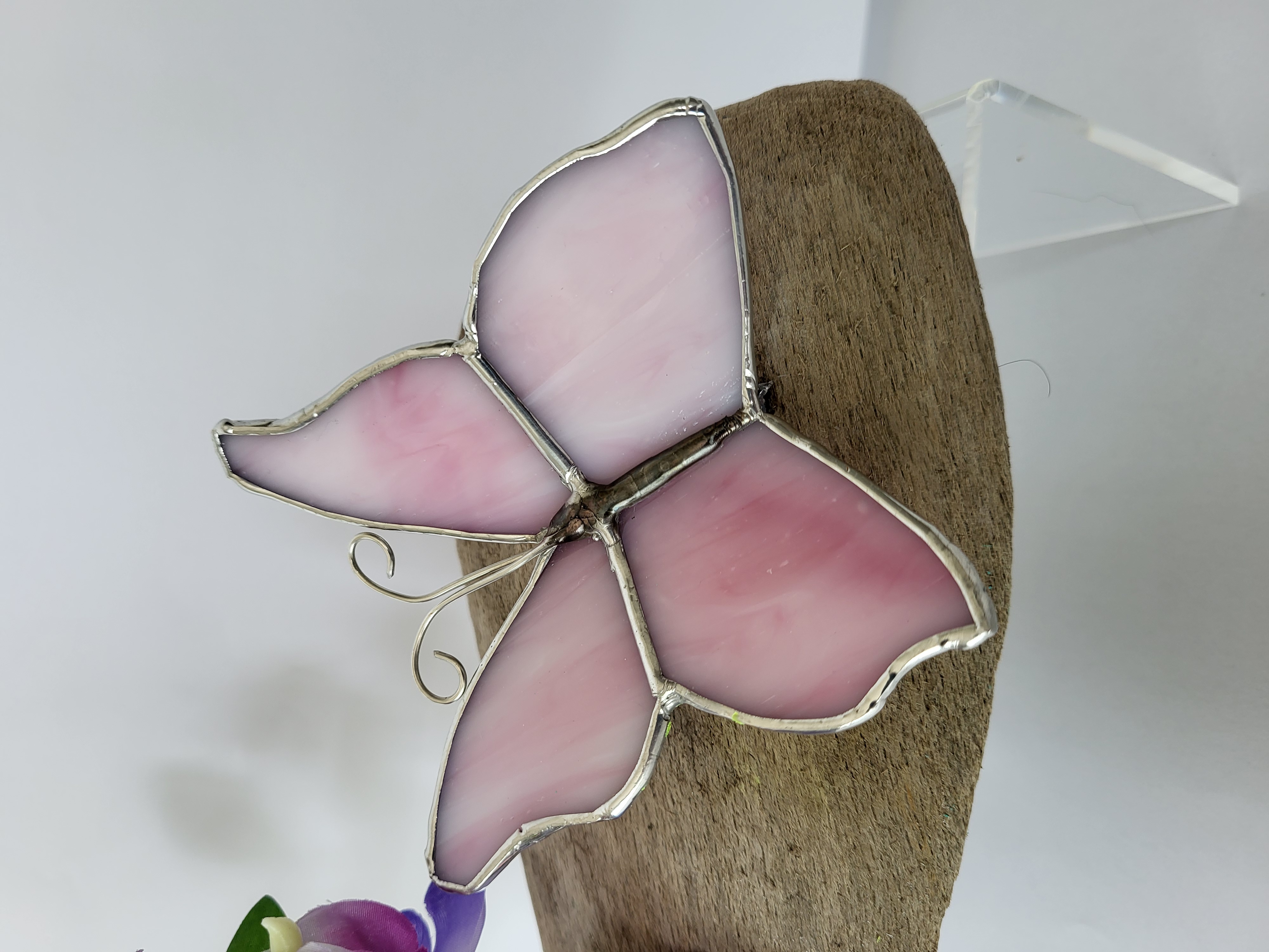 Butterflies and sweet peas on driftwood