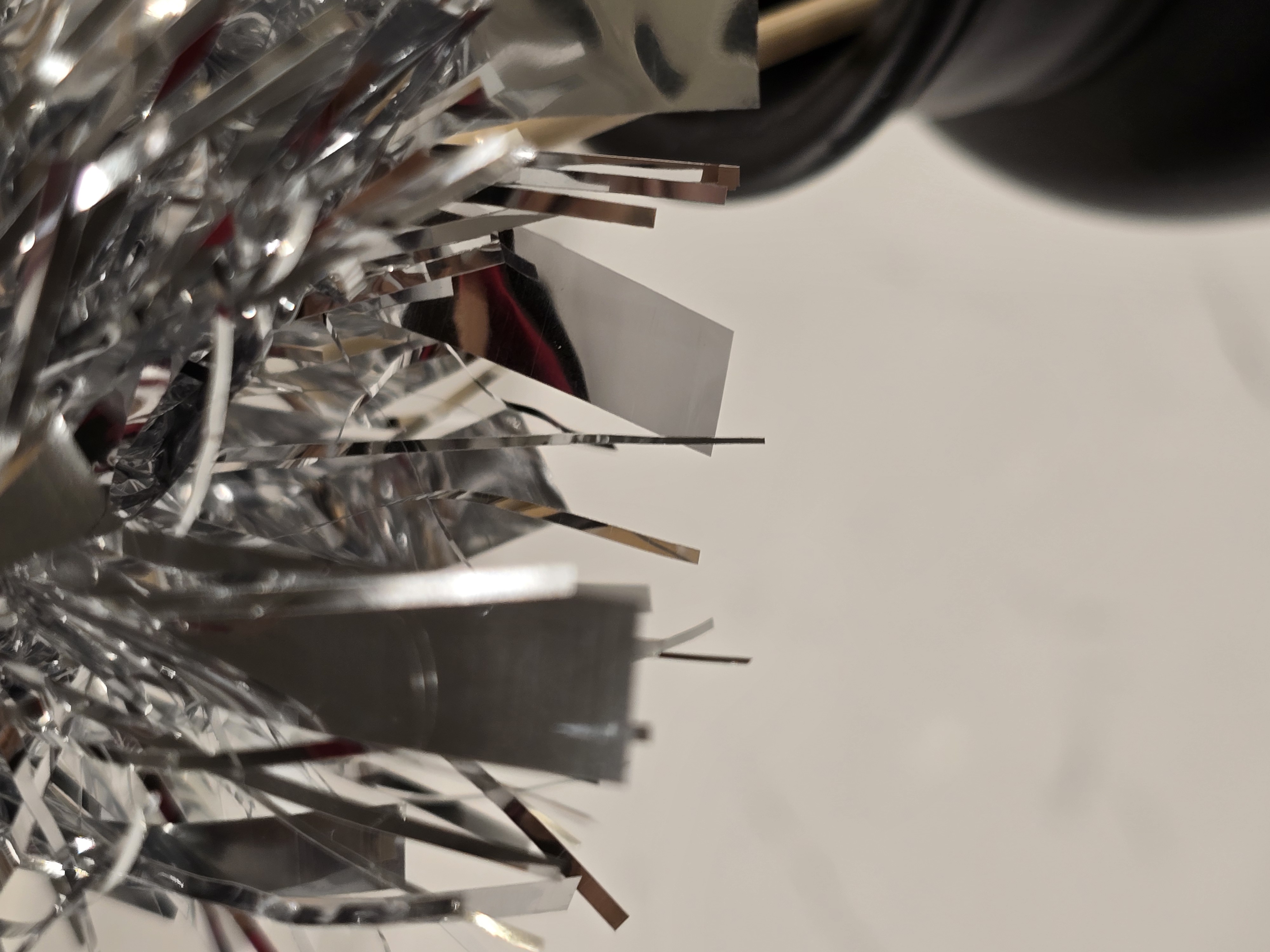 Silver Tinsel Garland On A Stick