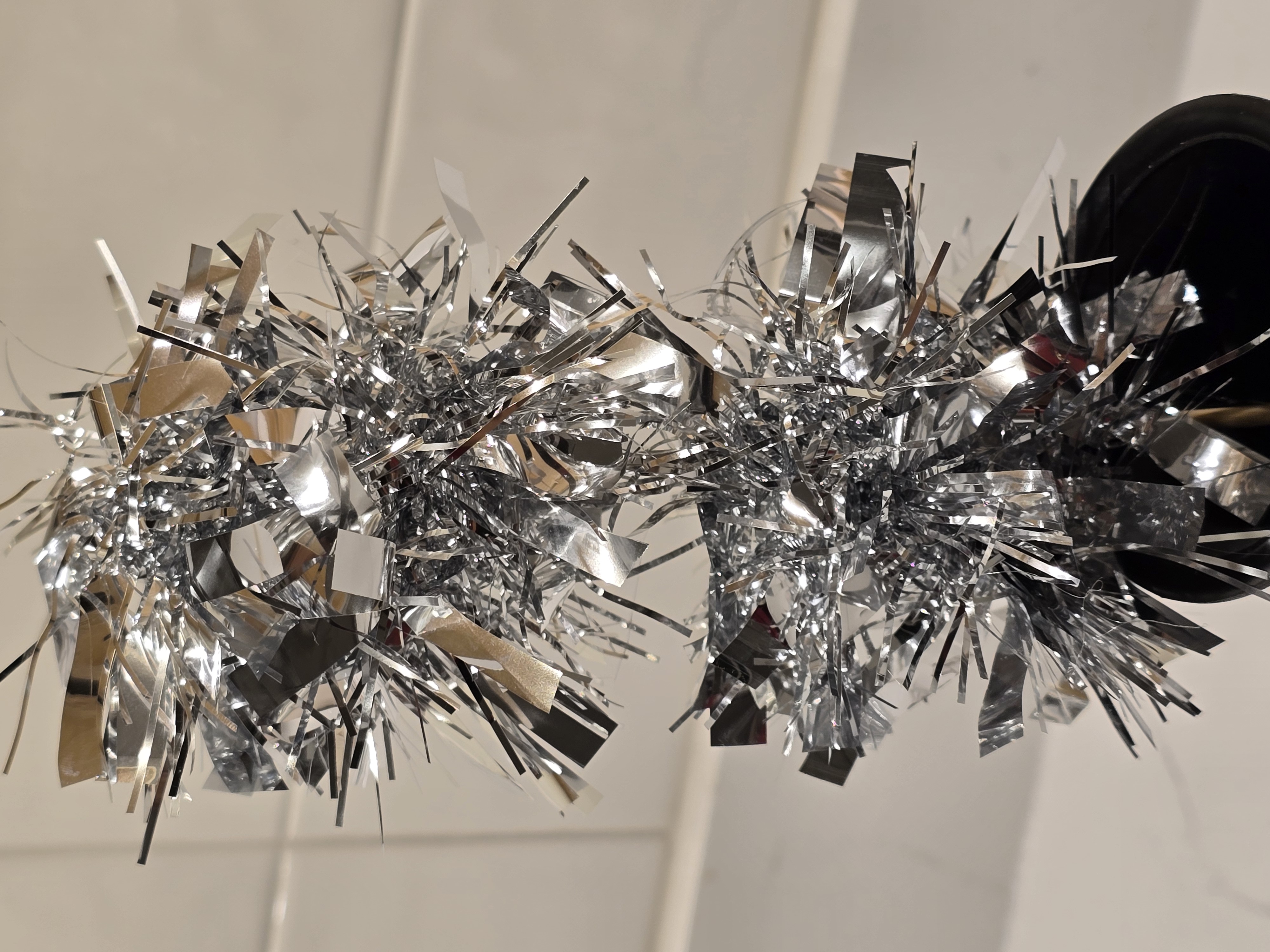 Silver Tinsel Garland On A Stick