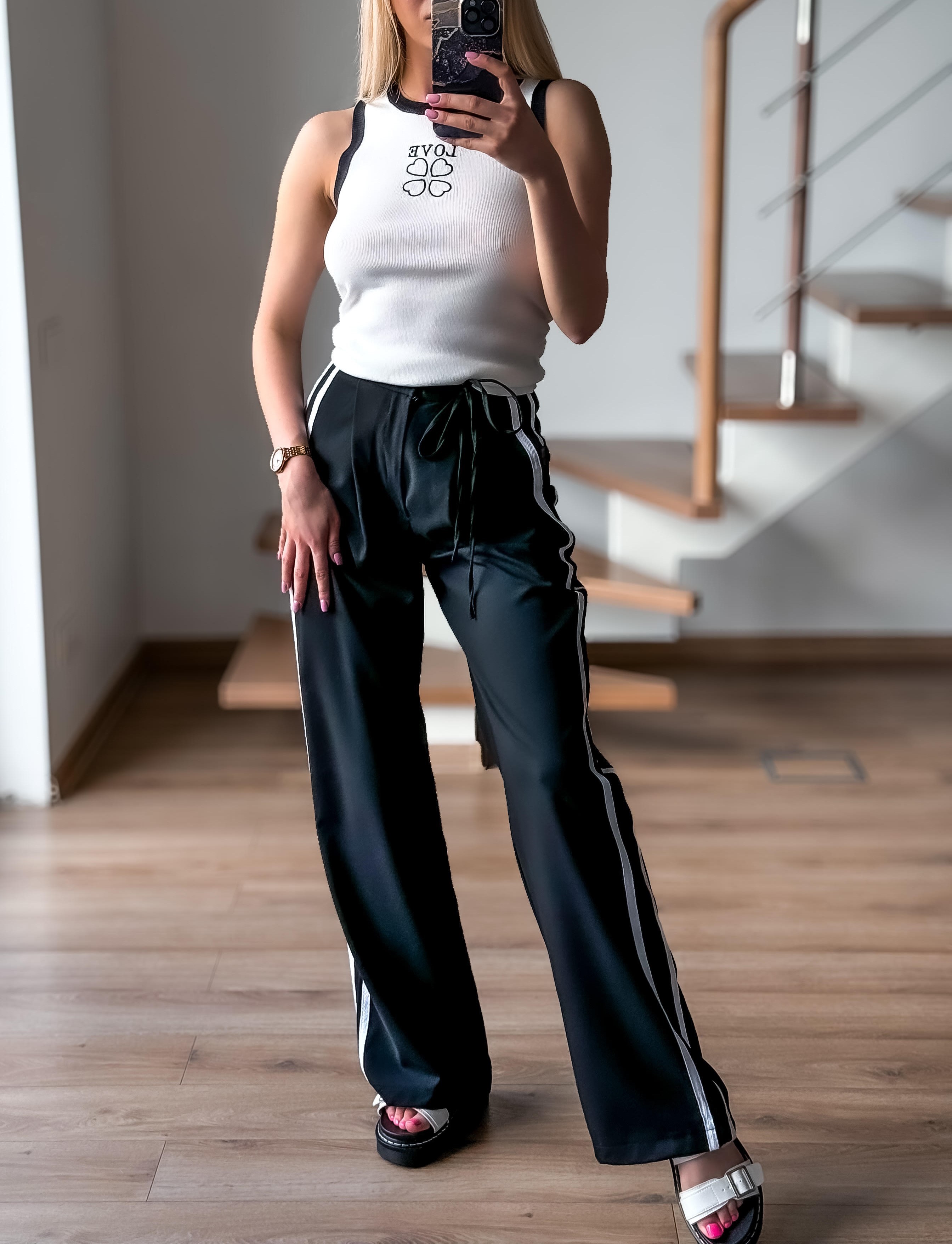 Juodos kelnės su juosta