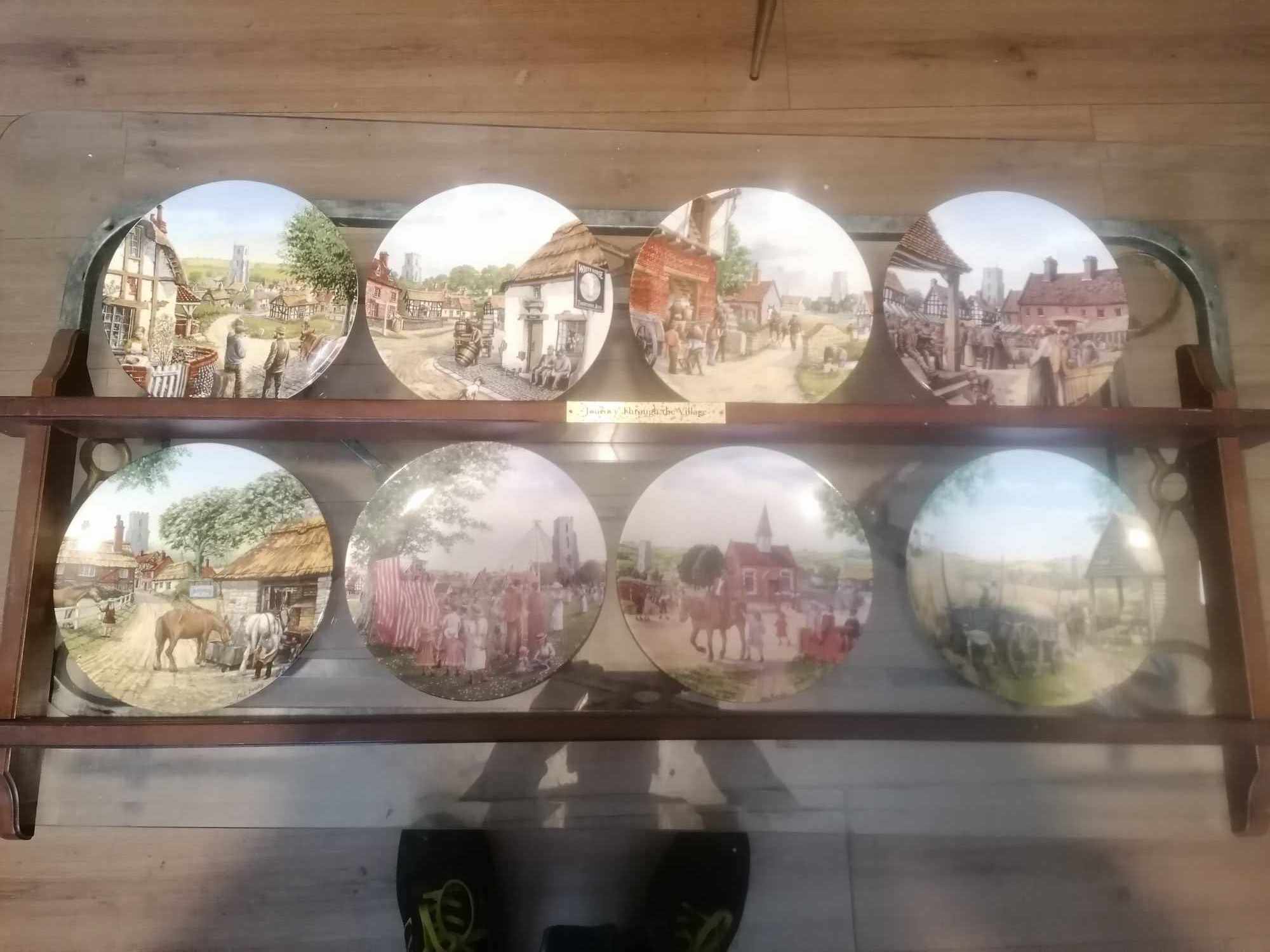 Set of 8 1990s royal doulton plates journey thru the village with genuine plate rack
