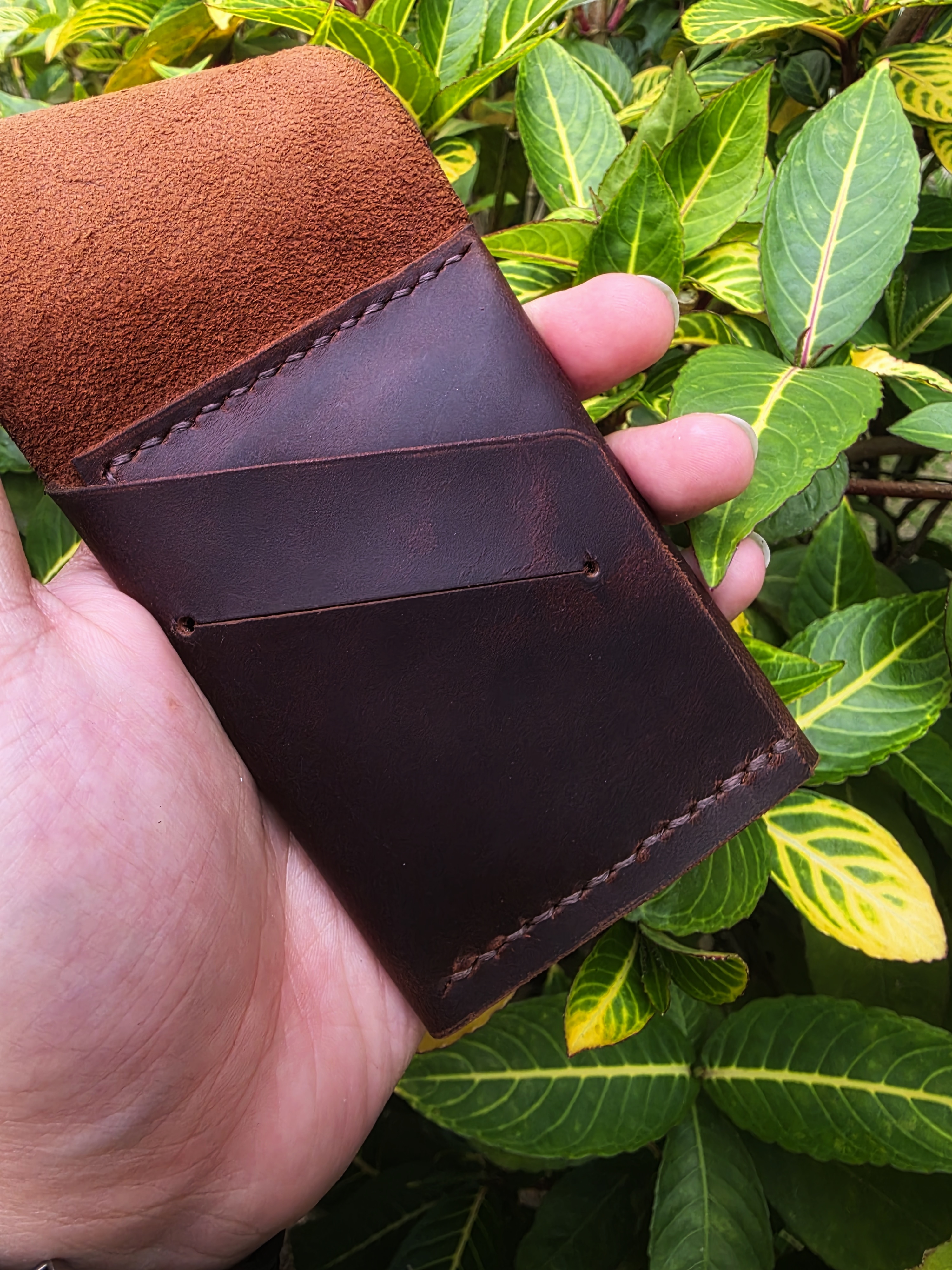 The Icaria: a cash flap wallet in brown pull up leather inspired by Oldis Road's wallet