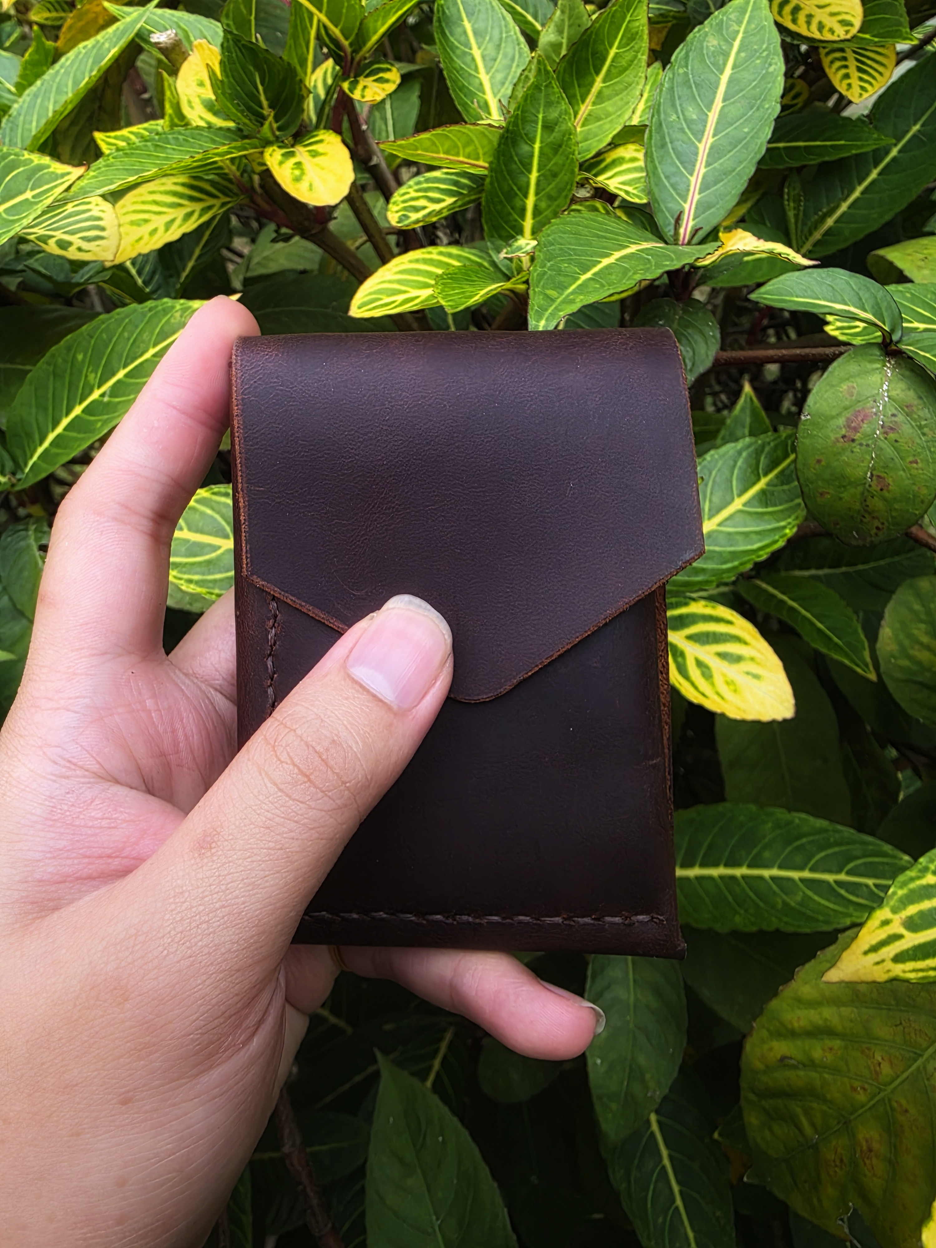 The Icaria: a cash flap wallet in brown pull up leather inspired by Oldis Road's wallet