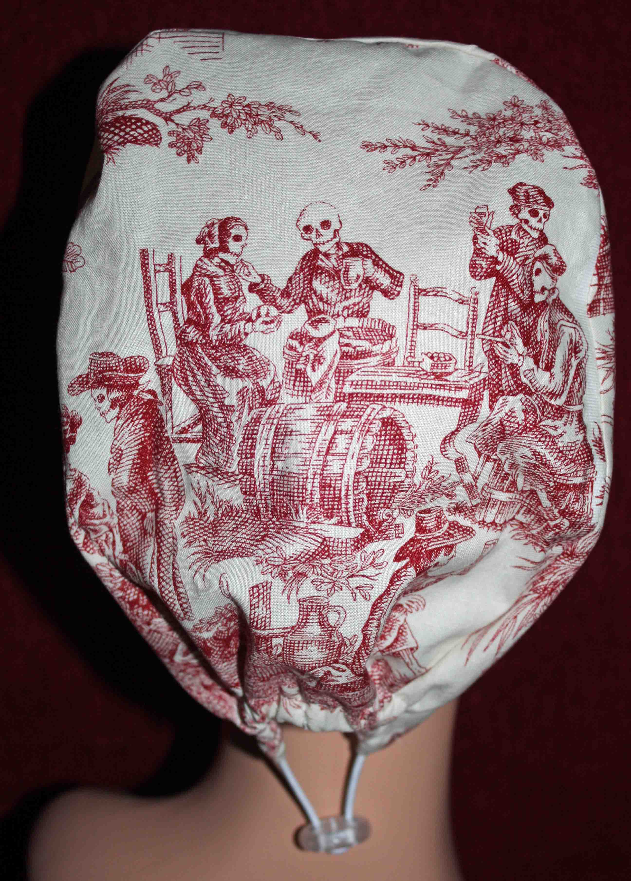 Handmade Skeleton Party Surgical/Scrub Cap - Back Displays Skeletons Sitting at a Table