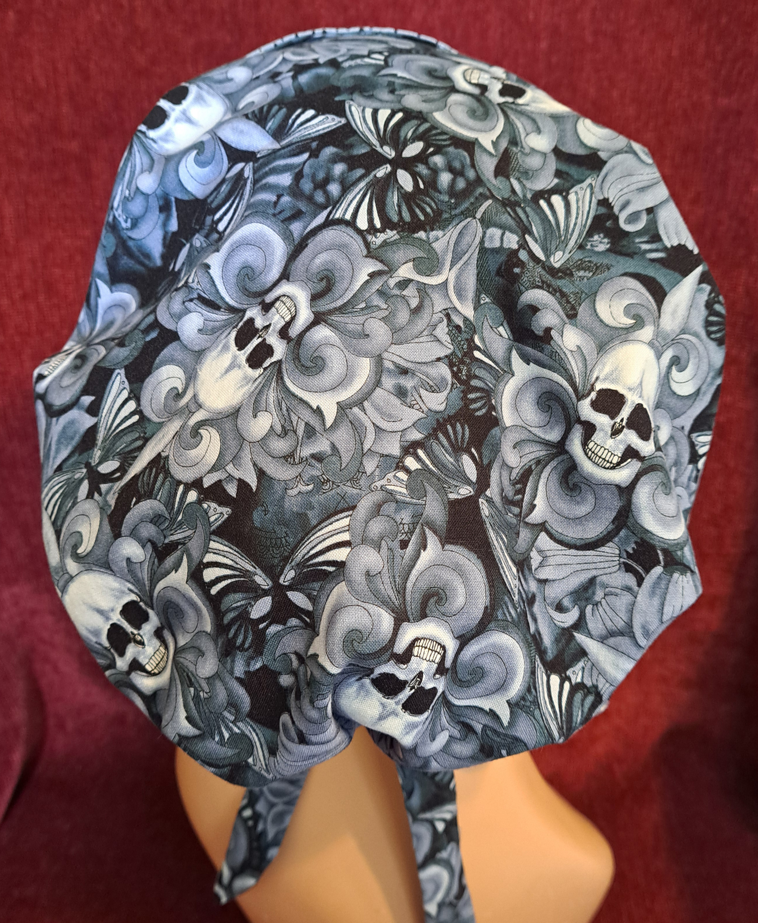 Handmade Reversible Pony Tail Scrub Cap - Gray Skull Fabric Reverses to Gray and Black Dot Fabric