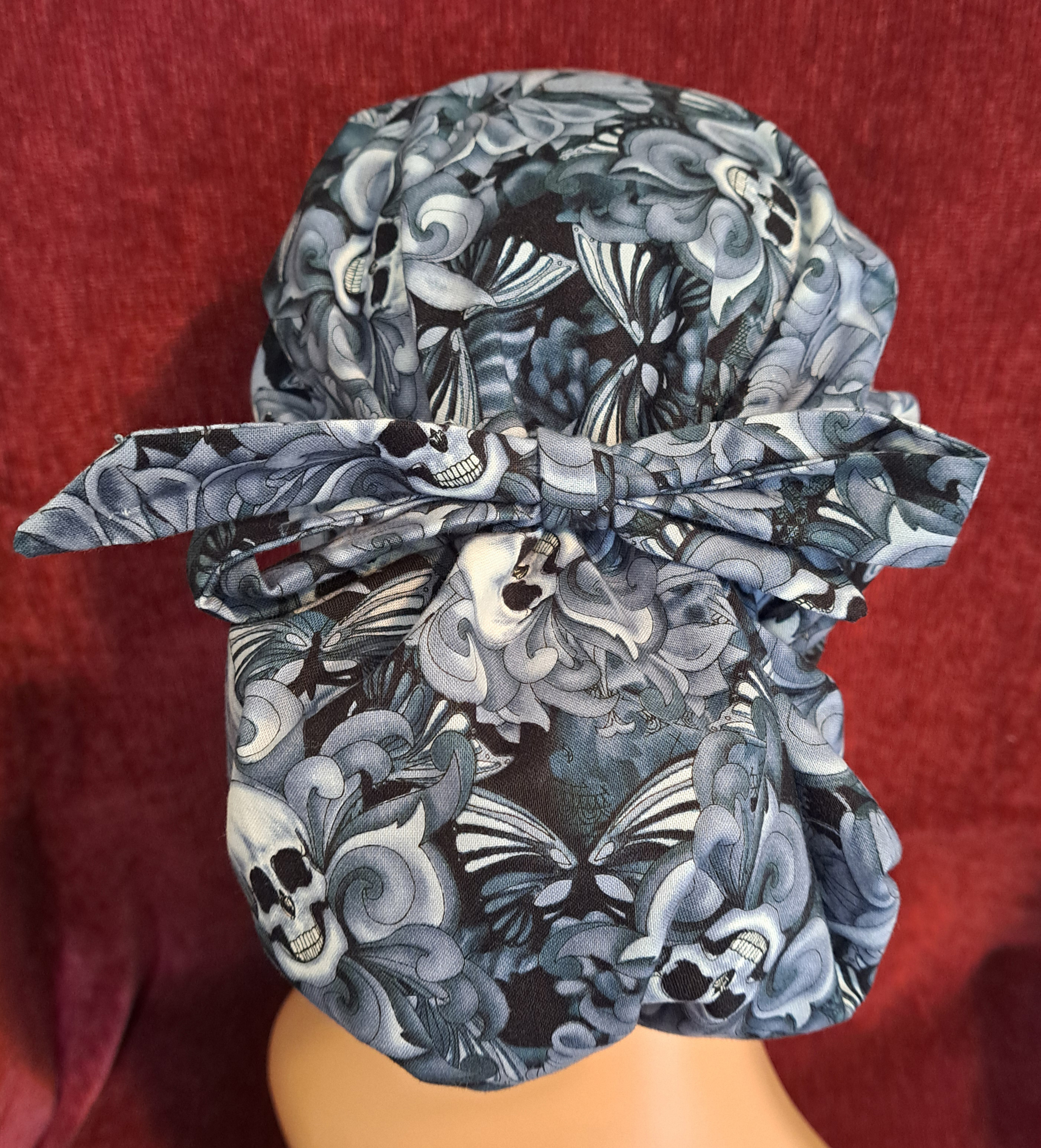 Handmade Reversible Pony Tail Scrub Cap - Gray Skull Fabric Reverses to Gray and Black Dot Fabric