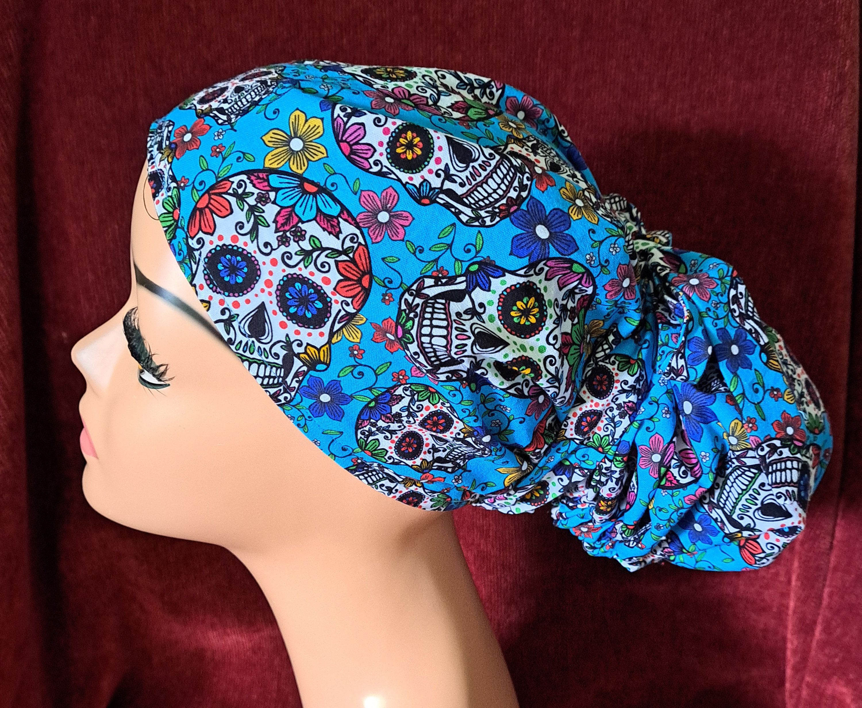 Handmade Sugar Skulls Reversible Pony Tail Scrub Cap - Turquoise Sugar Skull Fabric Reverses to Black Sugar Skull Fabric