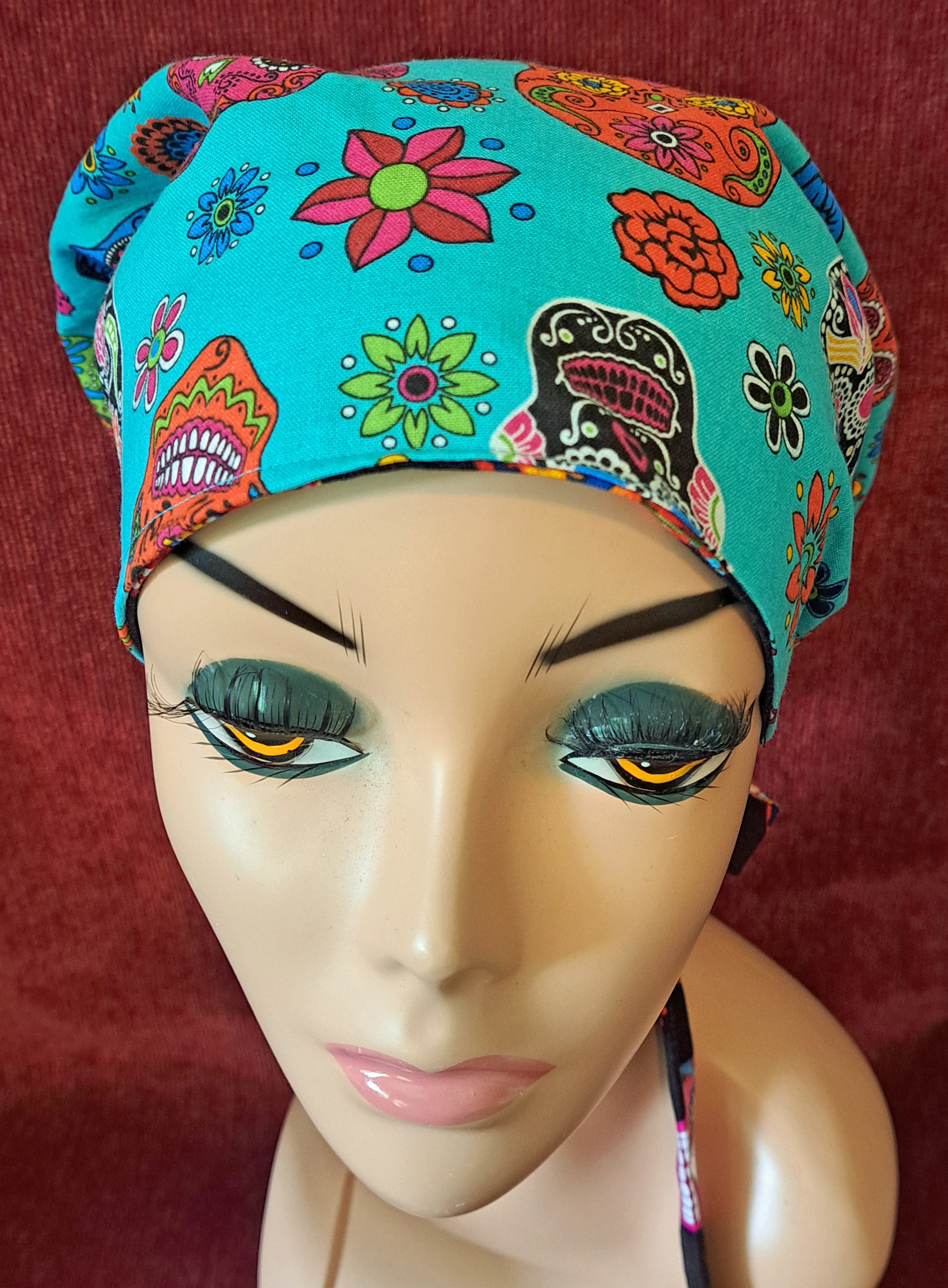 Handmade Reversible Pony Tail Scrub Cap - Turquoise Skull Fabric Reverses to Black Skull Fabric
