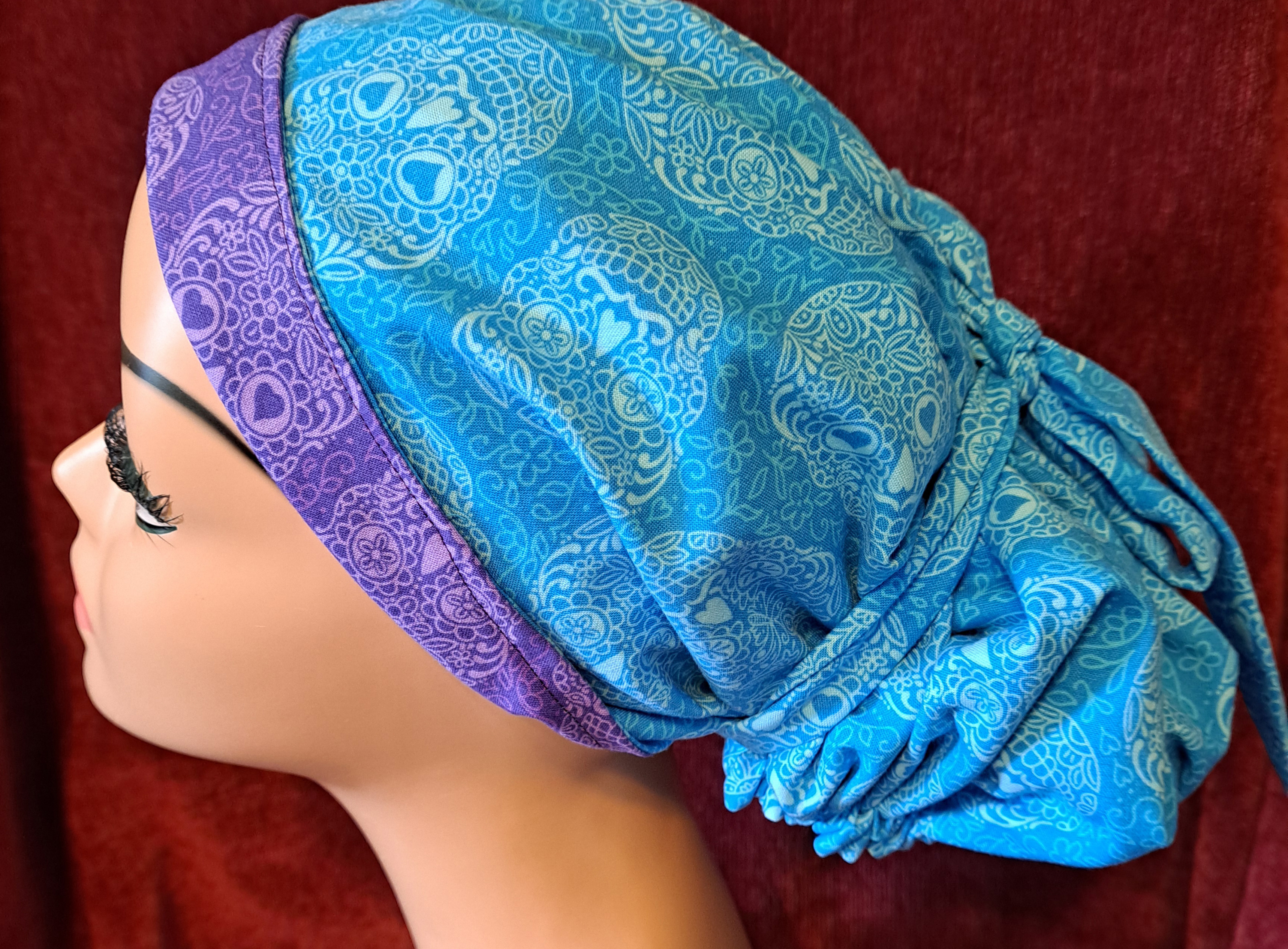 Handmade Reversible Pony Tail Scrub Cap - Turquoise Sugar Skull Fabric Reverses to Purple Sugar Skull Fabric