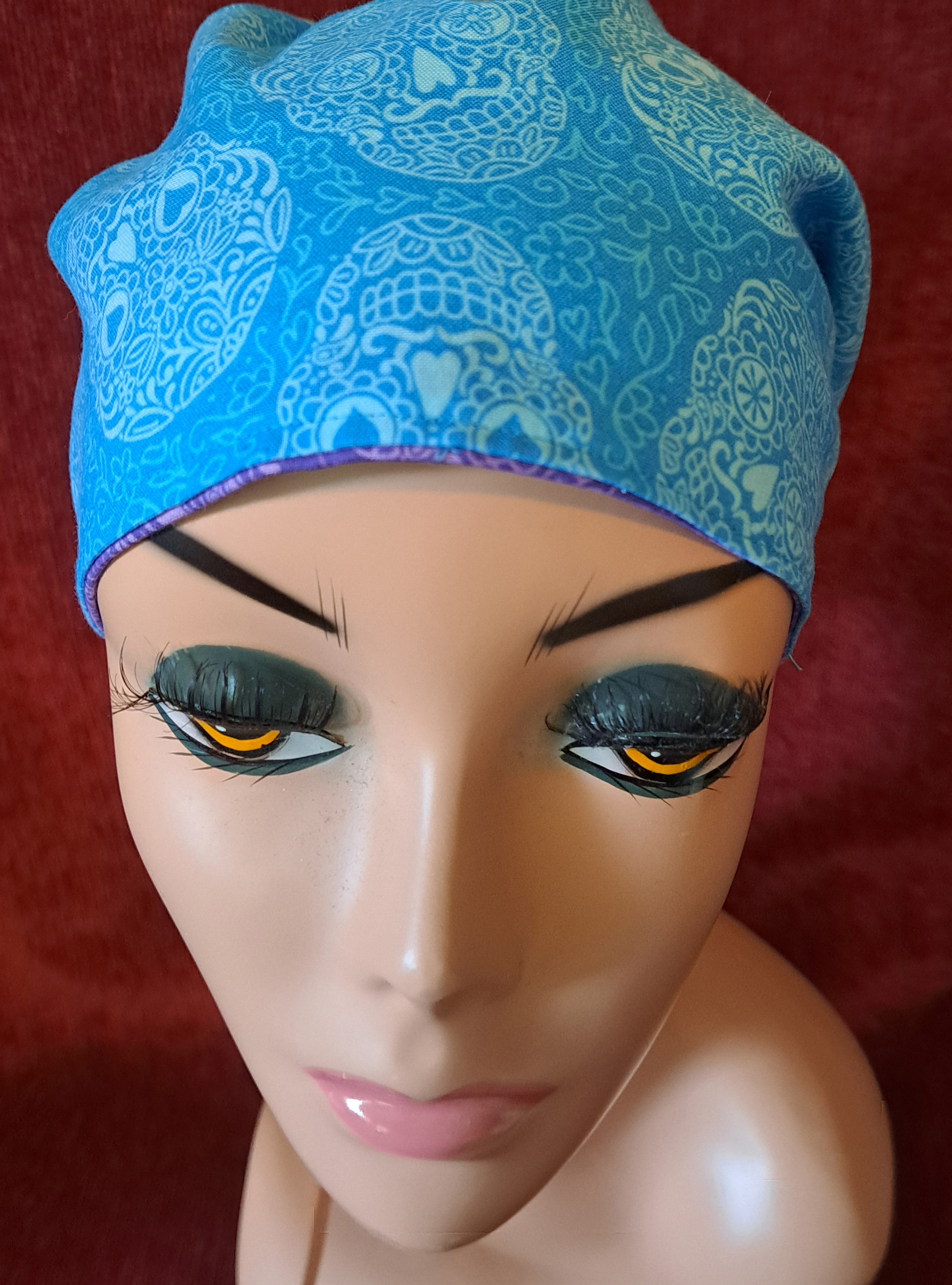 Handmade Reversible Pony Tail Scrub Cap - Turquoise Sugar Skull Fabric Reverses to Purple Sugar Skull Fabric