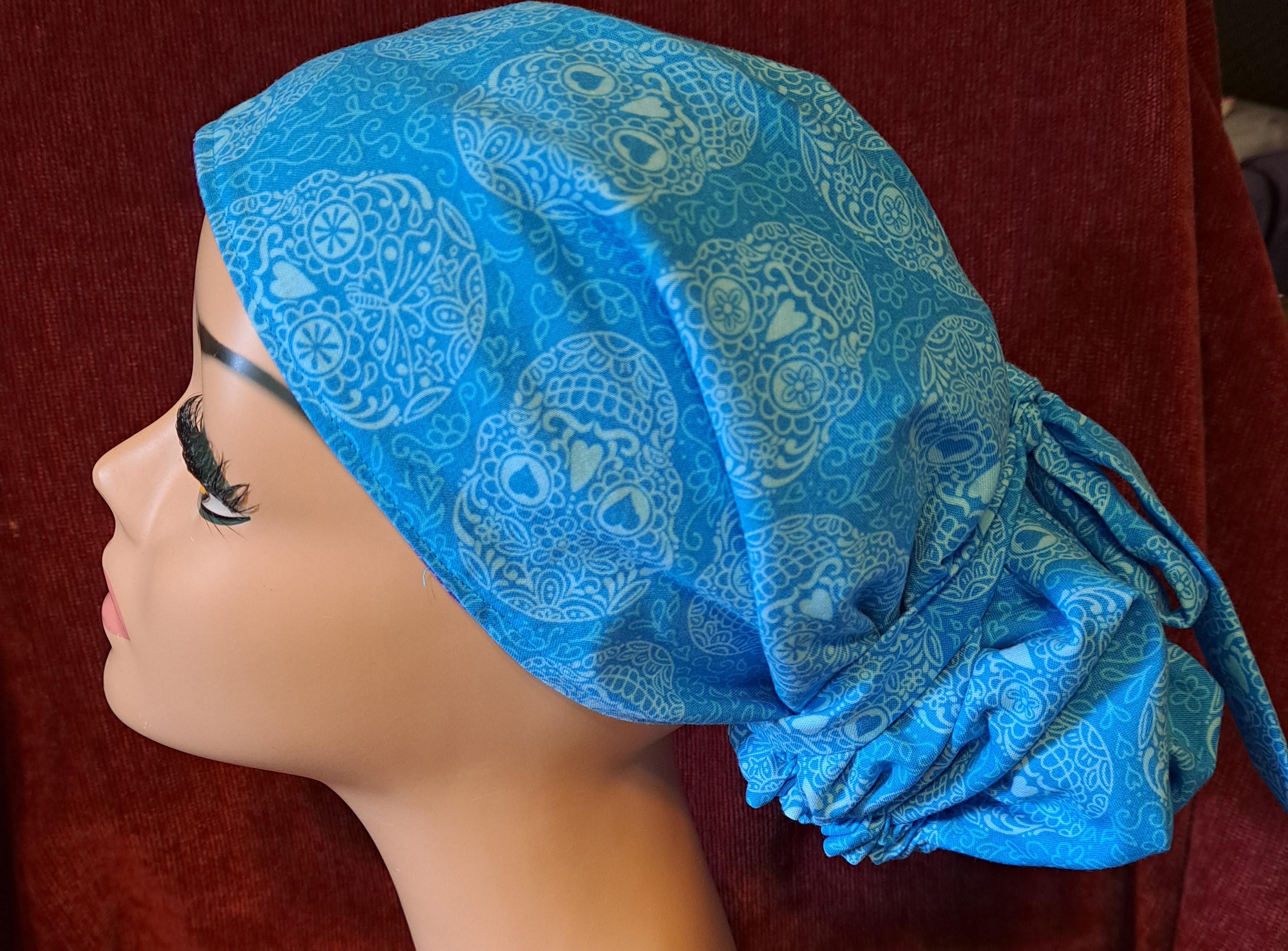 Handmade Reversible Pony Tail Scrub Cap - Turquoise Sugar Skull Fabric Reverses to Purple Sugar Skull Fabric