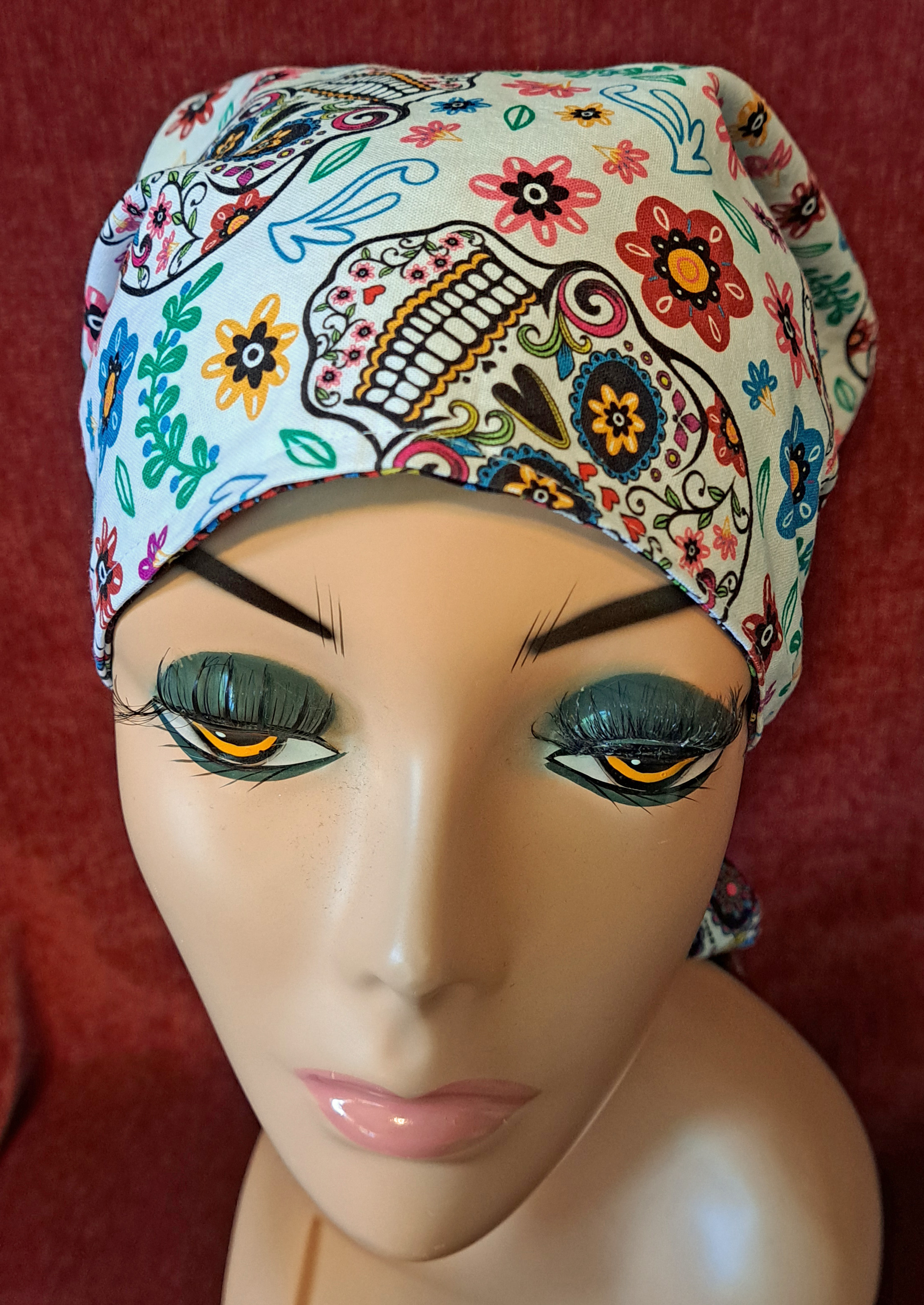 Handmade Reversible Pony Tail Scrub Cap - White Sugar Skull Fabric Reverses to Black Sugar Skull Fabric