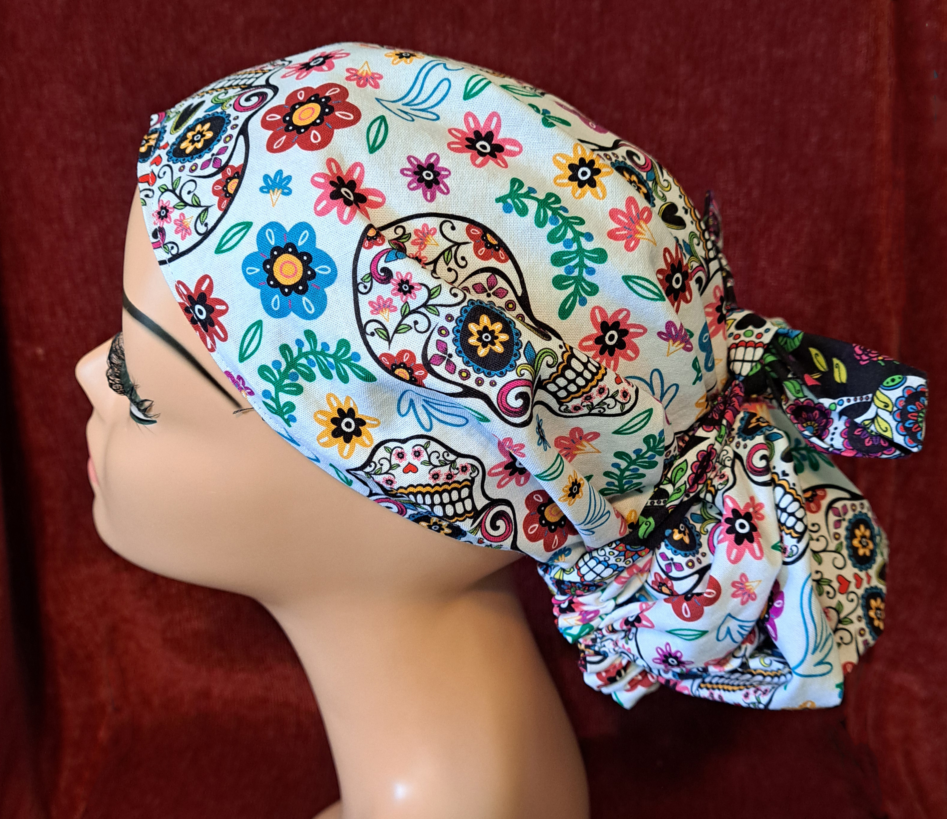 Handmade Reversible Pony Tail Scrub Cap - White Sugar Skull Fabric Reverses to Black Sugar Skull Fabric