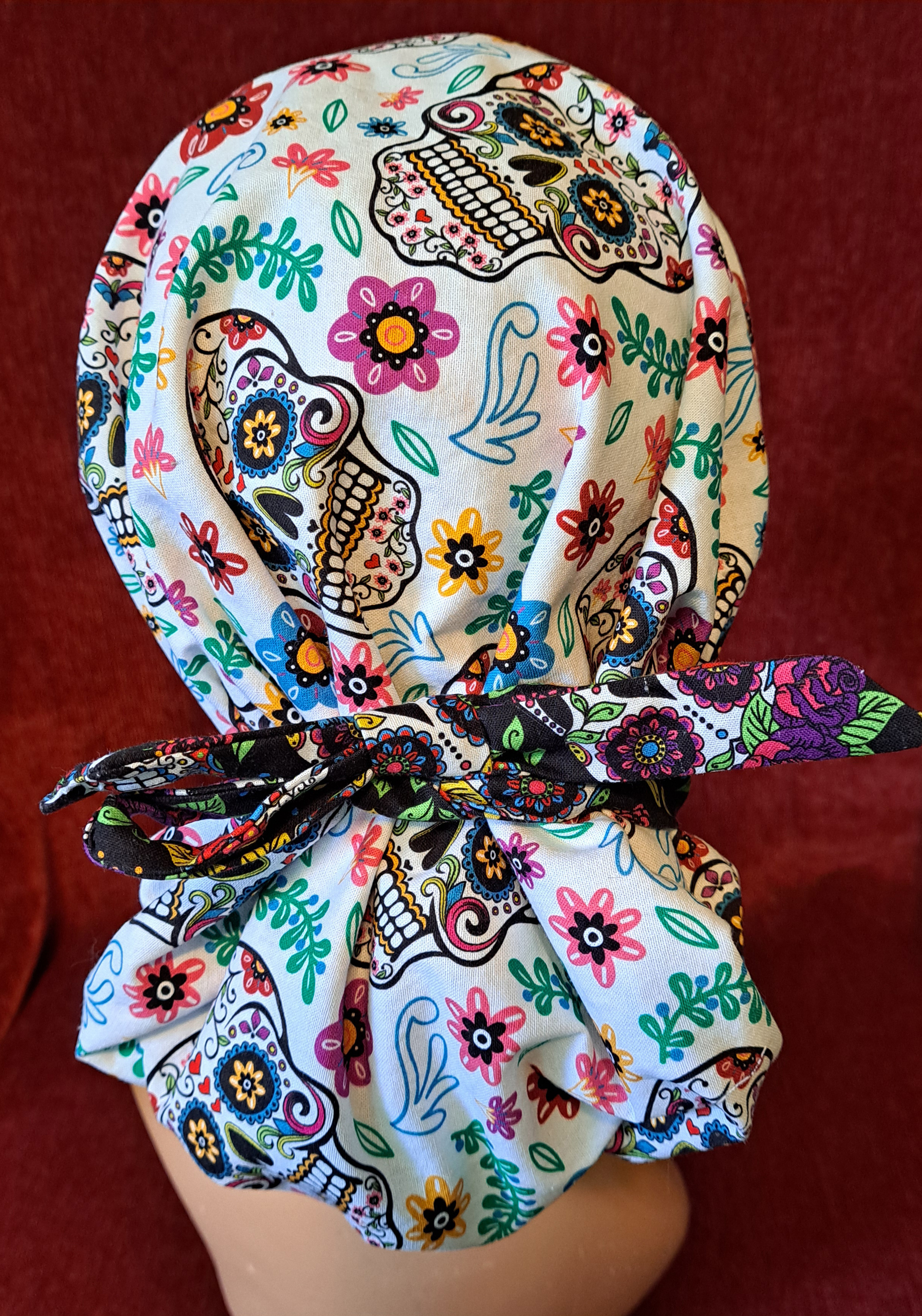 Handmade Reversible Pony Tail Scrub Cap - White Sugar Skull Fabric Reverses to Black Sugar Skull Fabric