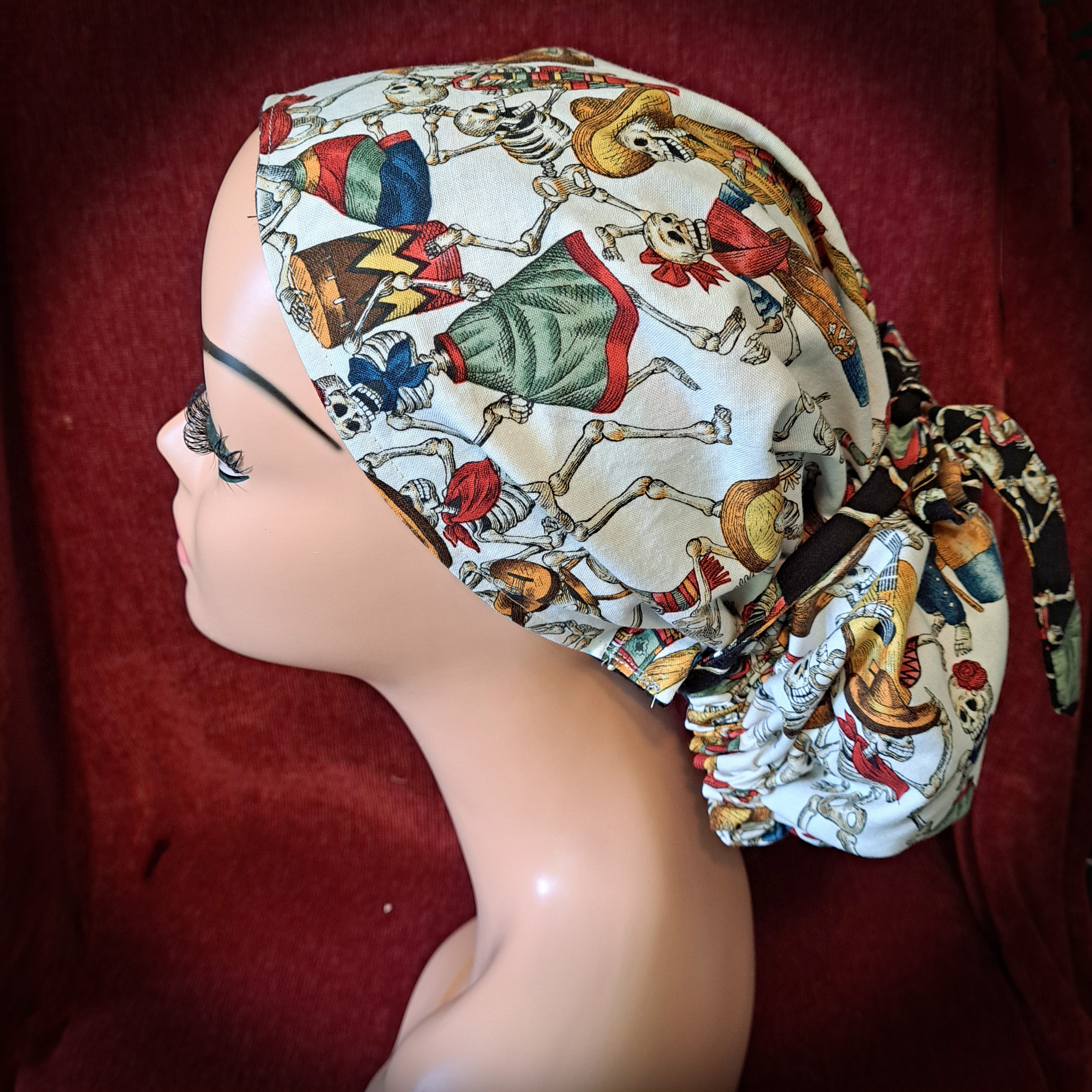 Handmade Reversible Pony Tail Scrub Cap - White Skeleton Fabric Reverses to Black Skeleton Fabric