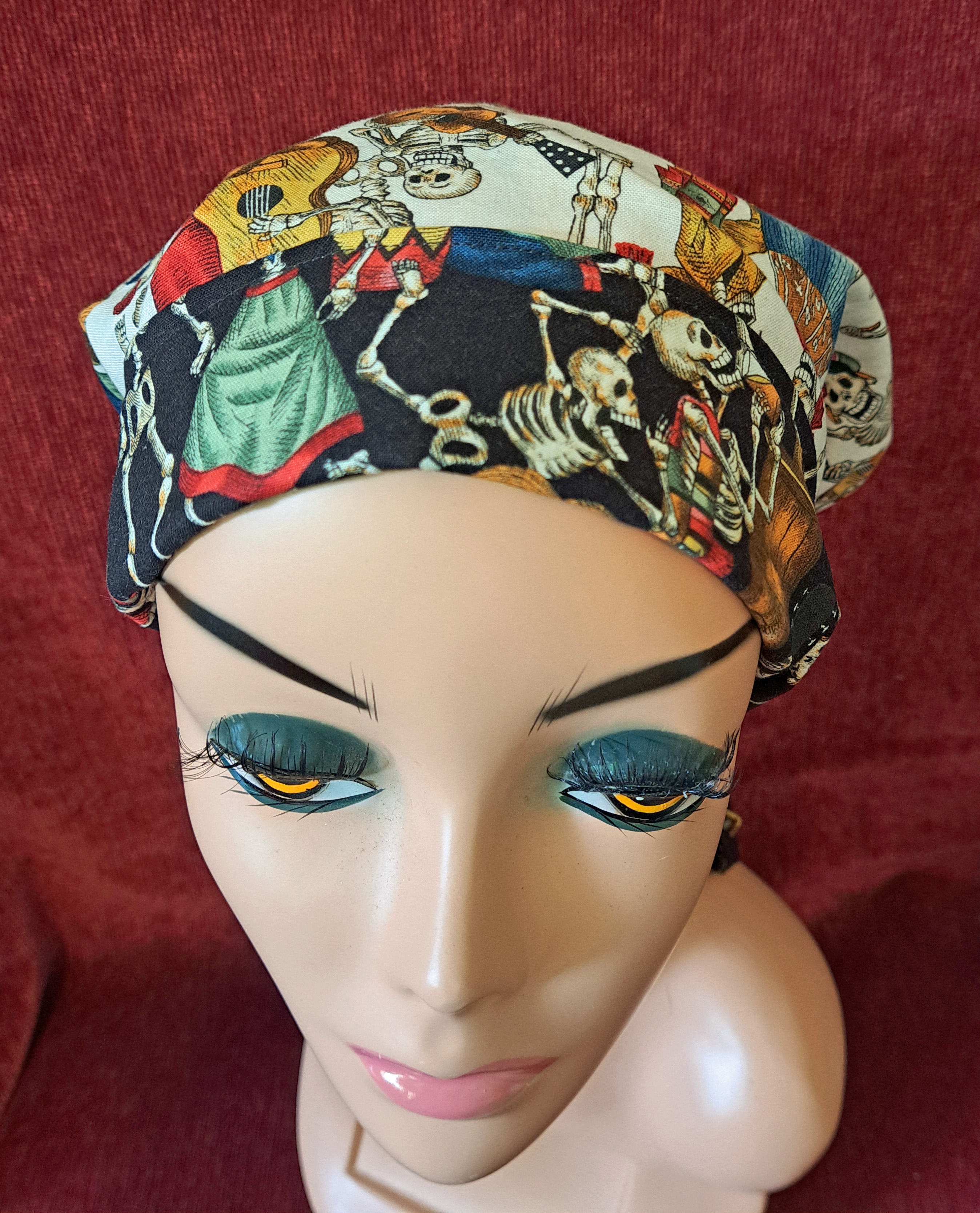 Handmade Reversible Pony Tail Scrub Cap - White Skeleton Fabric Reverses to Black Skeleton Fabric