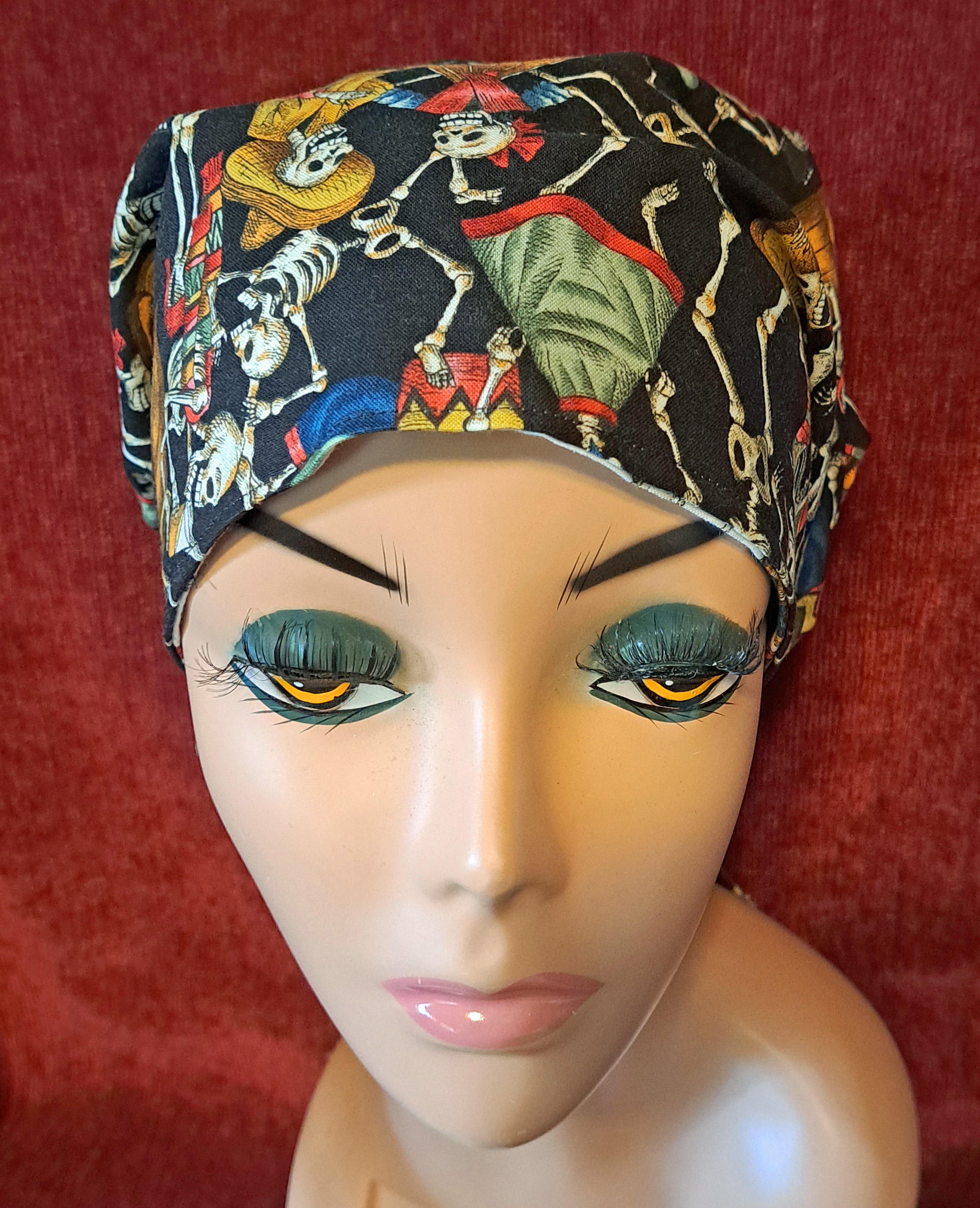 Handmade Reversible Pony Tail Scrub Cap - White Skeleton Fabric Reverses to Black Skeleton Fabric