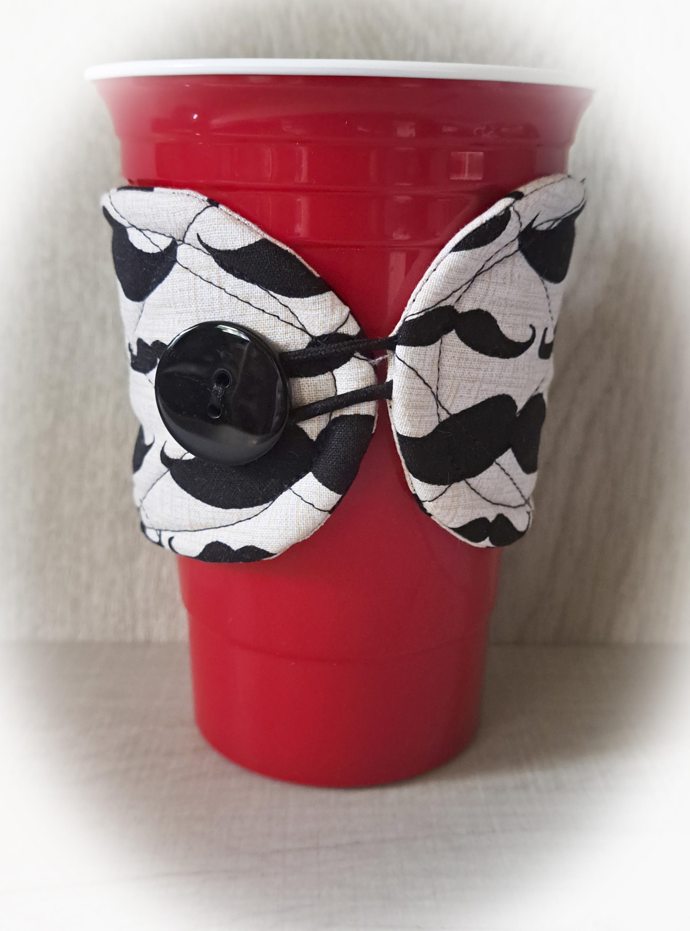 Handmade Reusable Cup Sleeve/Mug Cozy in a Moustache Fabric