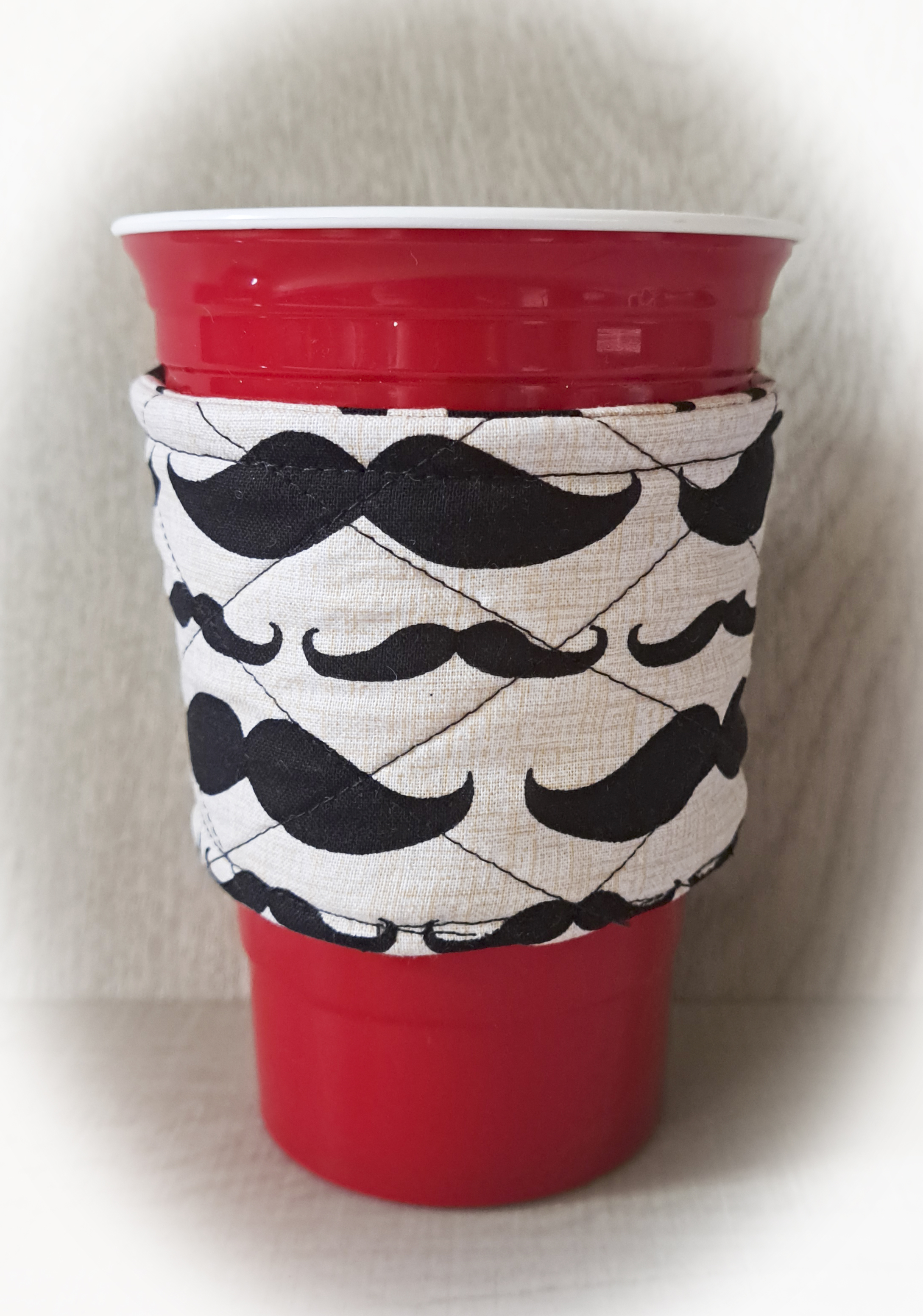 Handmade Reusable Cup Sleeve/Mug Cozy in a Moustache Fabric