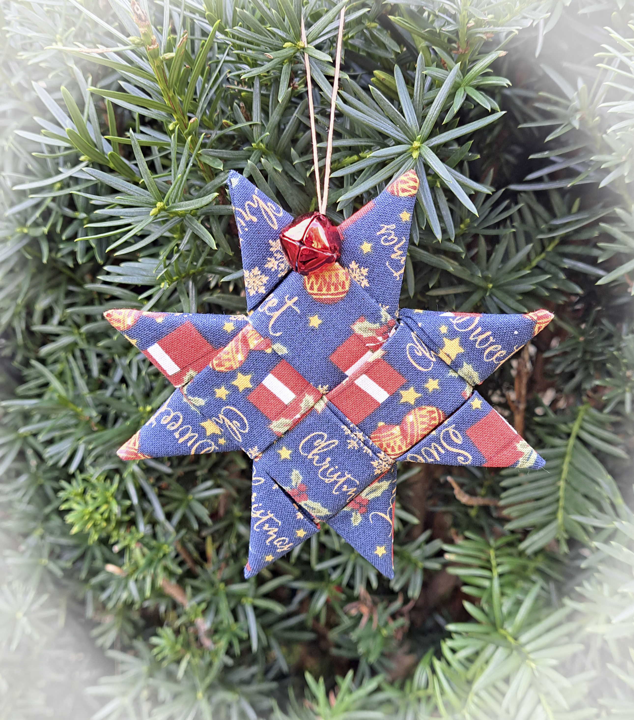 Handcrafted Scandinavian Star Ornament in Blue Fabric Featuring Presents and Stars