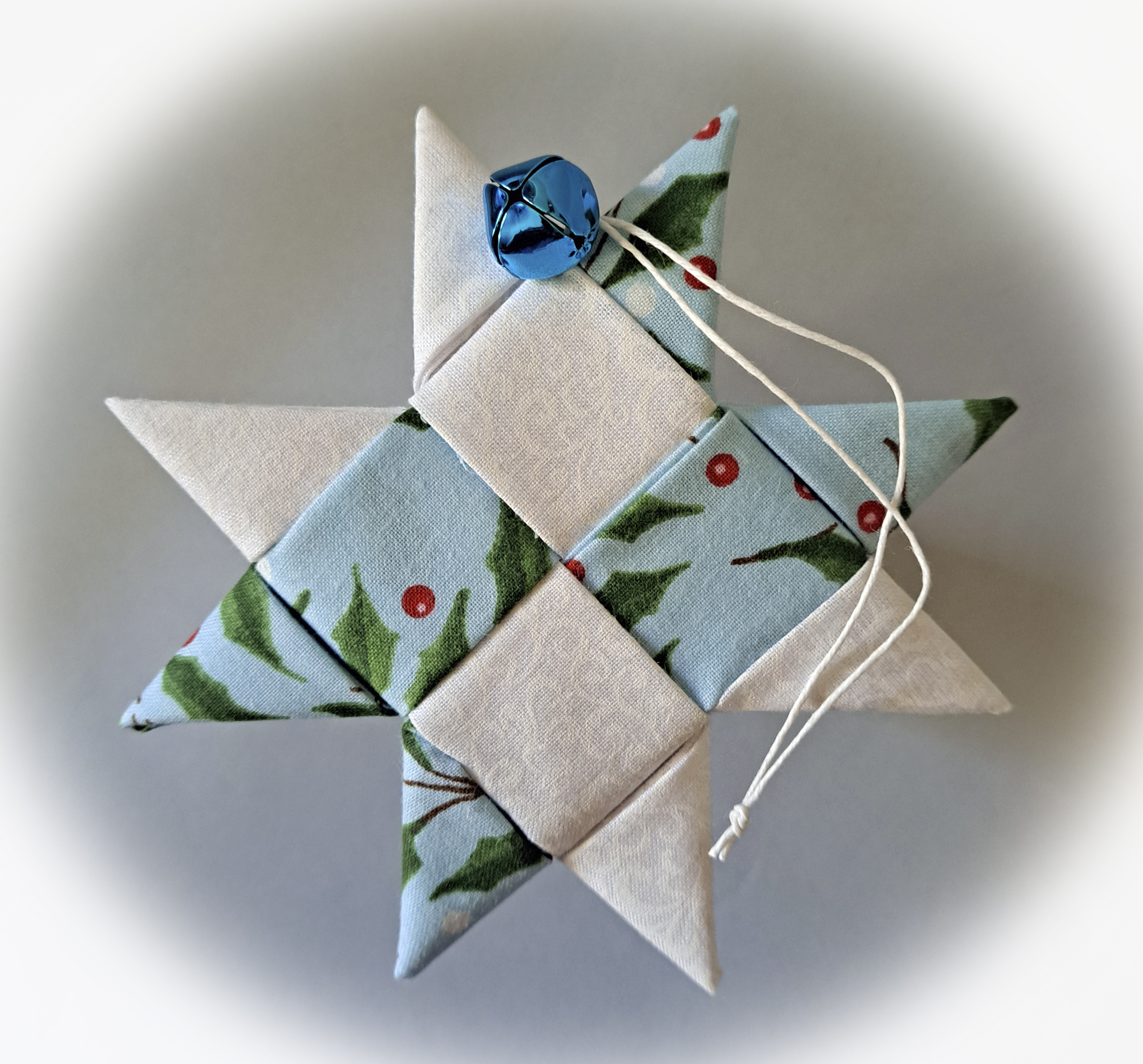 Handcrafted Scandinavian Fabric Star Ornament Adorned with Blue or White Bell