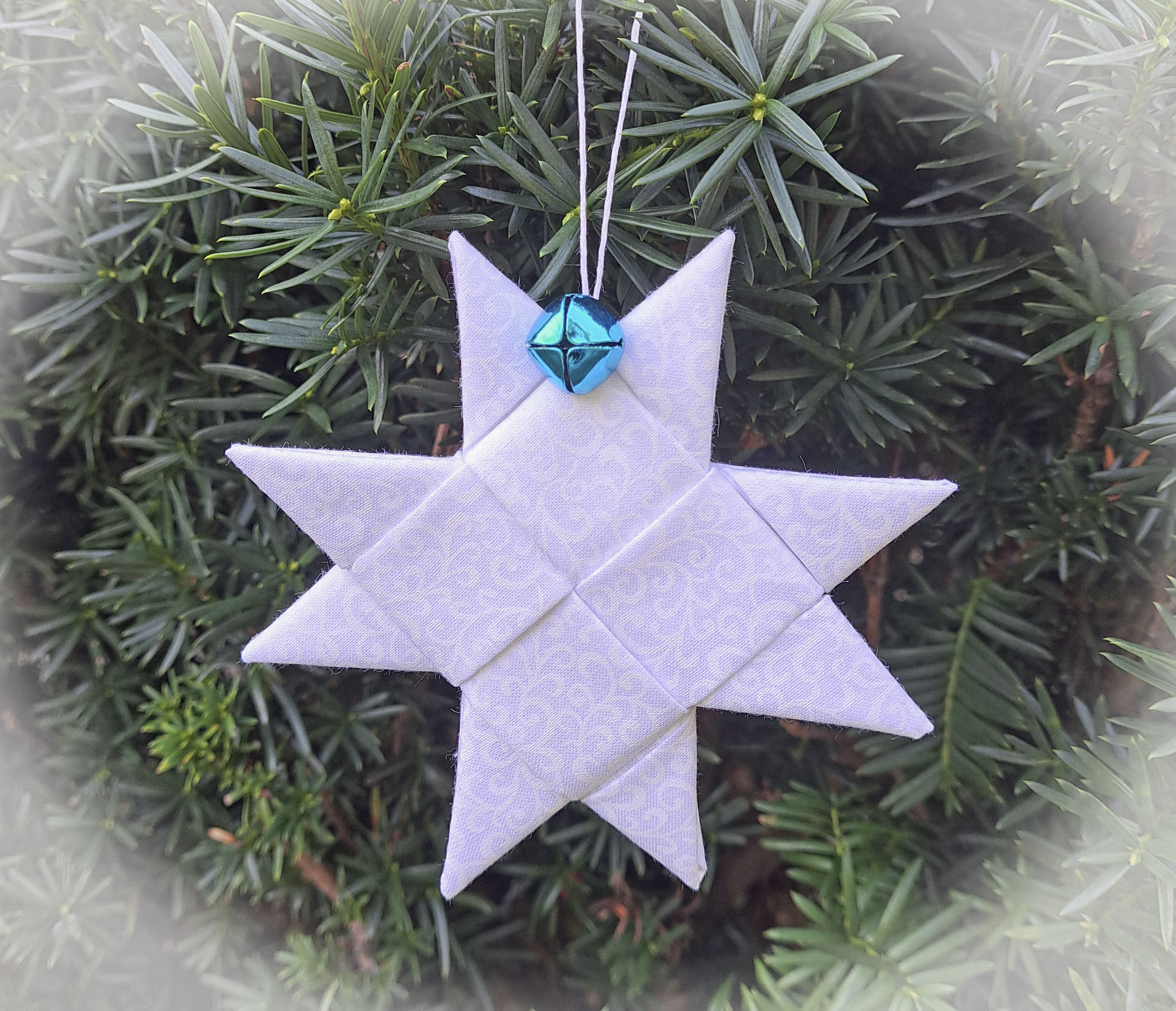 Handcrafted Scandinavian Blue and White Fabric Star Ornament Adorned with Blue or White Bell